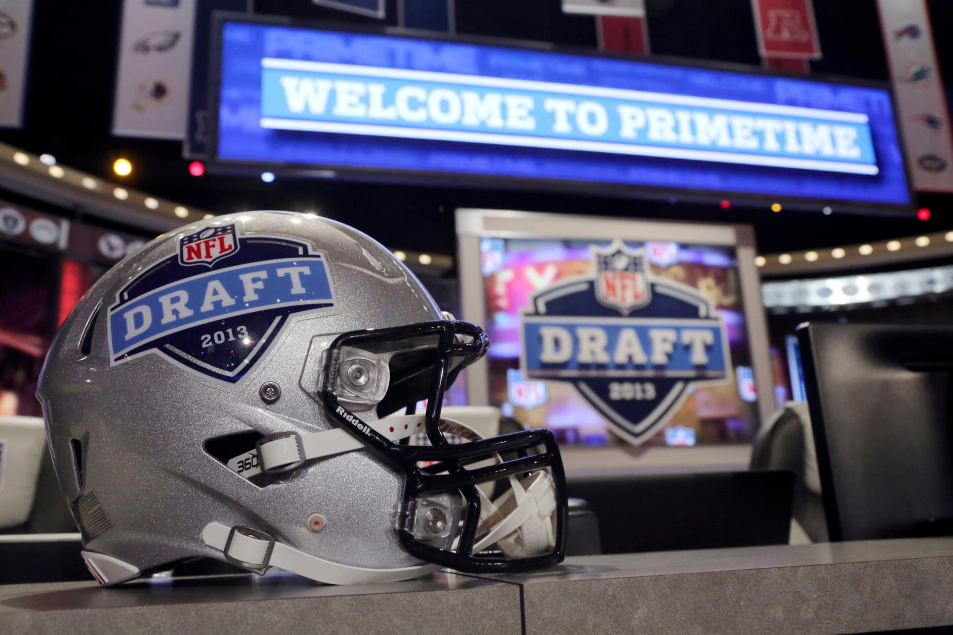 A helmet with the NFL football draft logo is placed on a table before the first round, Thursday, April 25, 2013, at Radio City Music Hall in New York. (AP Photo/Mary Altaffer)