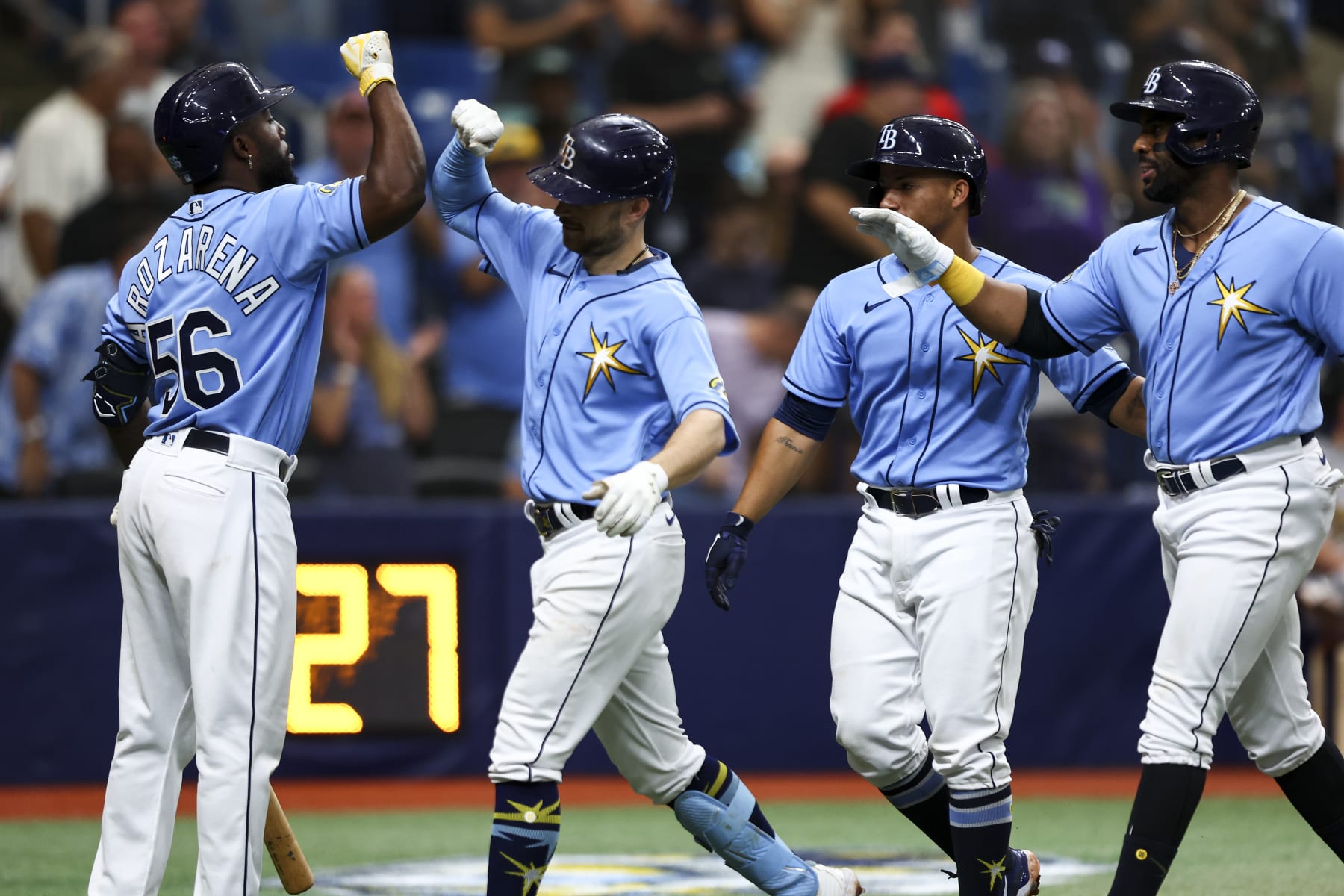 ST PETERSBURG, FLORIDA - APRIL 08: Brandon Lowe #8 of the Tampa Bay Rays celebrates with Randy Arozarena #56 after hitting a home run during the sixth inning against the Oakland Athletics at Tropicana Field on April 08, 2023 in St Petersburg, Florida. (Photo by Kevin Sabitus/Getty Images)