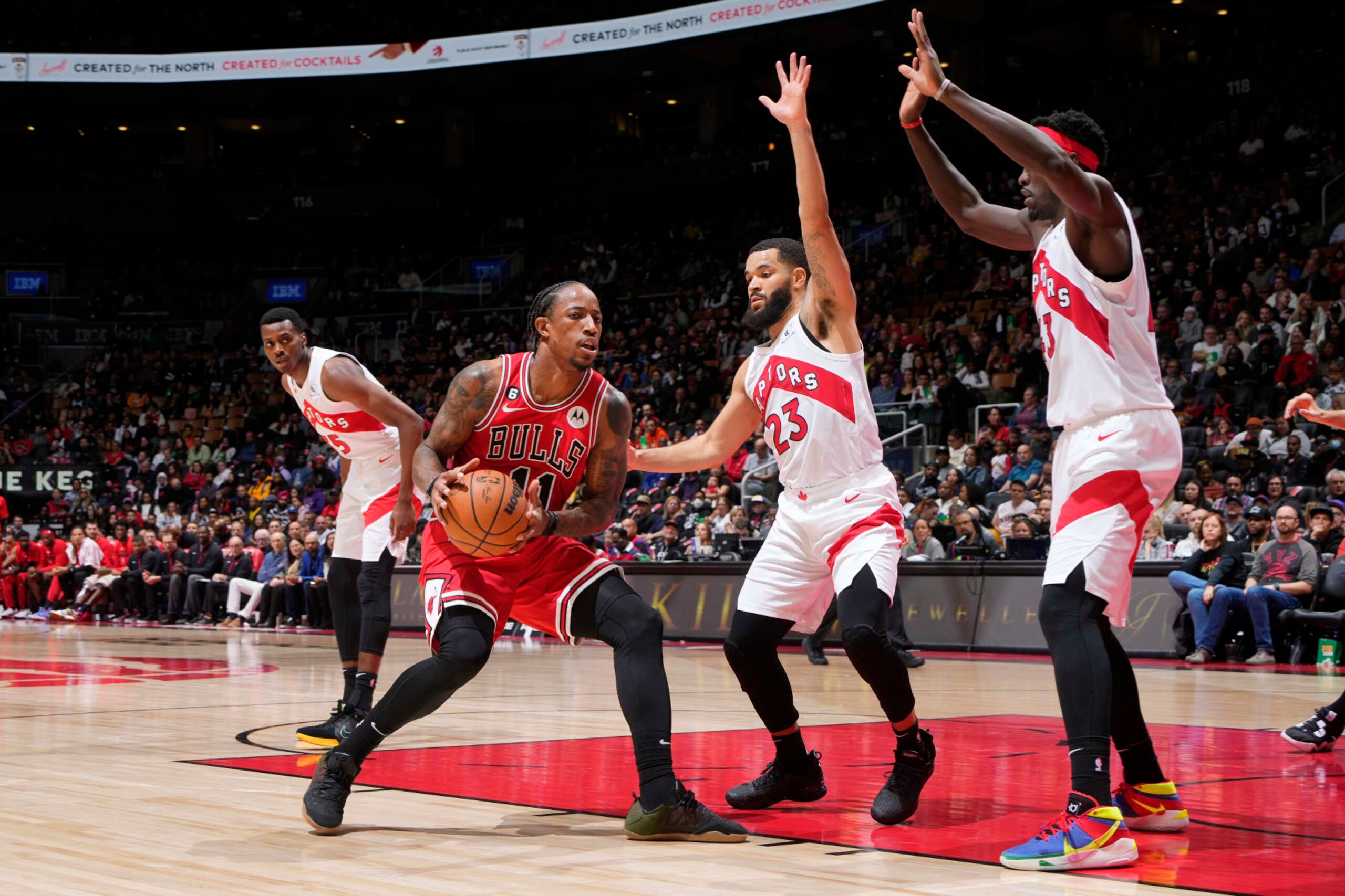 TORONTO, CANADA - OCTOBER 9: DeMar DeRozan #11 of the Chicago Bulls handles the ball during a preseason game against the Toronto Raptors, Fred VanVleet #23 of the Toronto Raptors and Pascal Siakam #43 play defense on October 9, 2022 at the Scotiabank Arena in Toronto, Ontario, Canada.  NOTE TO USER: User expressly acknowledges and agrees that, by downloading and or using this Photograph, user is consenting to the terms and conditions of the Getty Images License Agreement.  Mandatory Copyright Notice: Copyright 2022 NBAE (Photo by Mark Blinch/NBAE via Getty Images)