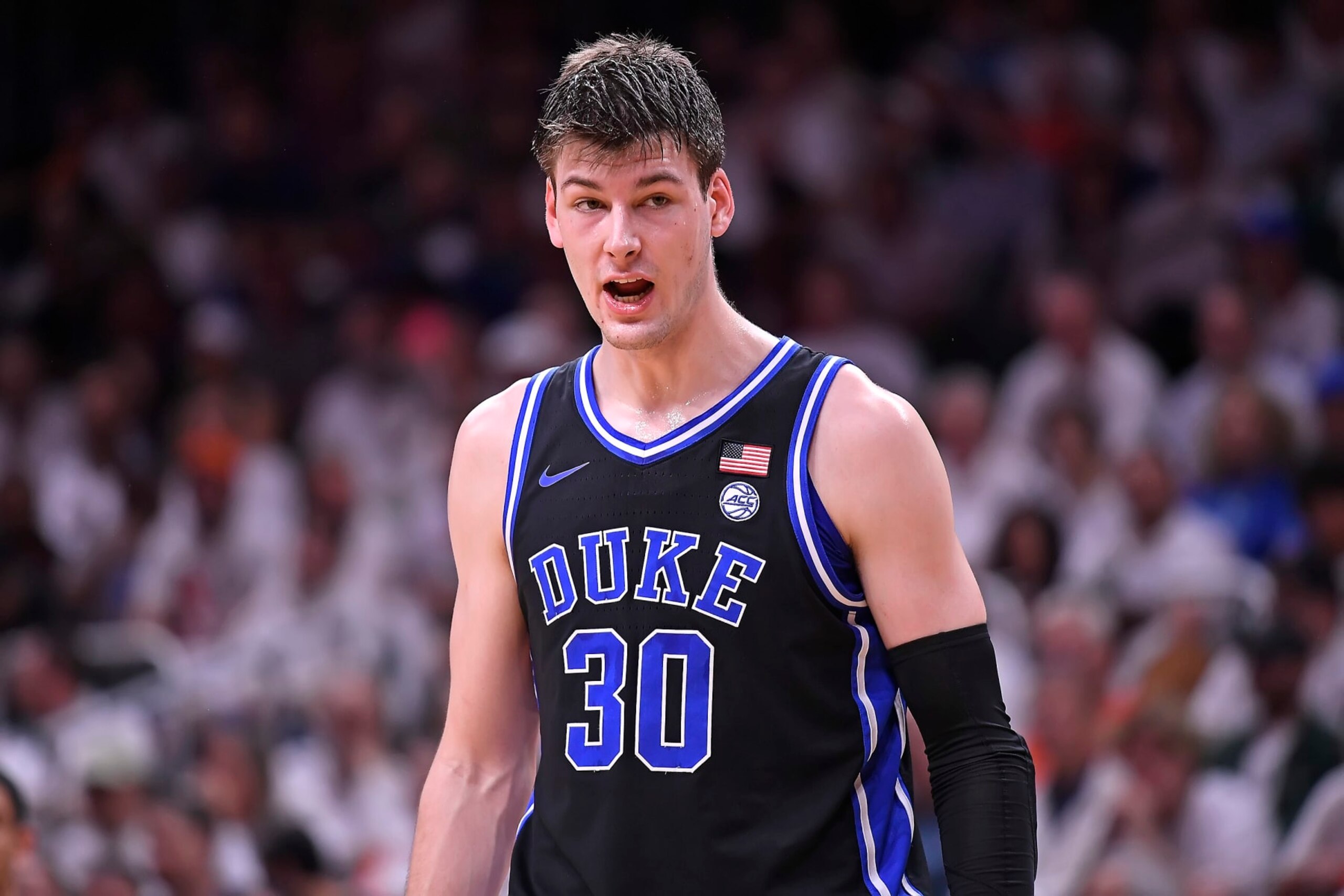 CORAL GABLES, FL - FEB 06: Duke center Kyle Filipowski (30) shouts instructions to a teammate in the first half as the Miami Hurricanes faced the Duke Blue Devils on February 6, 2023, at the Watsco Center in Coral Gables, Florida. (Photo by Samuel Lewis/Icon Sportswire via Getty Images)