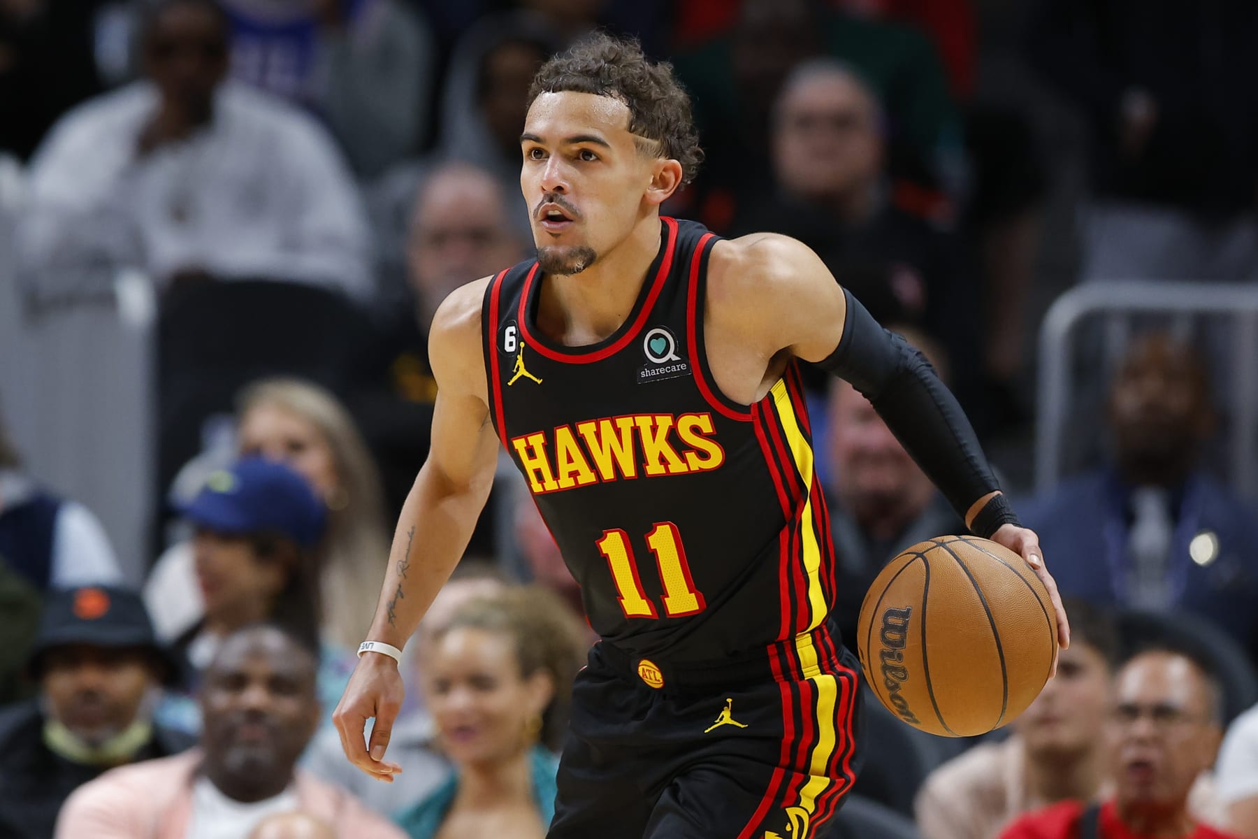 ATLANTA, GA - APRIL 07: Trae Young #11 of the Atlanta Hawks drives down the court during the first half against the Philadelphia 76ers at State Farm Arena on April 7, 2023 in Atlanta, Georgia. NOTE TO USER: User expressly acknowledges and agrees that, by downloading and or using this photograph, User is consenting to the terms and conditions of the Getty Images License Agreement. (Photo by Todd Kirkland/Getty Images)