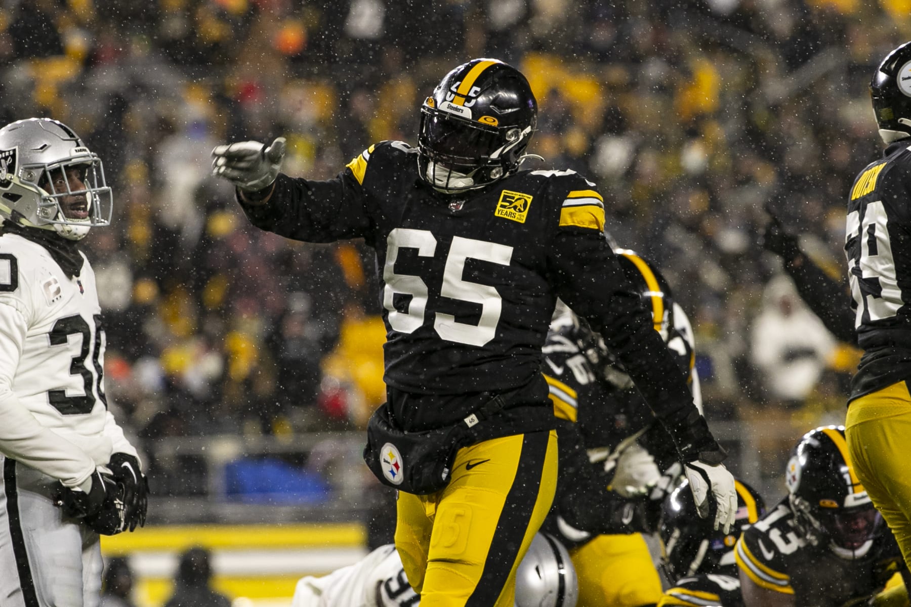 PITTSBURGH, PA - DECEMBER 24: Pittsburgh Steelers offensive tackle Dan Moore Jr. (65) celebrates during the national football league game between the Las Vegas Raiders and the Pittsburgh Steelers on December 24, 2022 at Acrisure Stadium in Pittsburgh, PA. (Photo by Mark Alberti/Icon Sportswire via Getty Images)