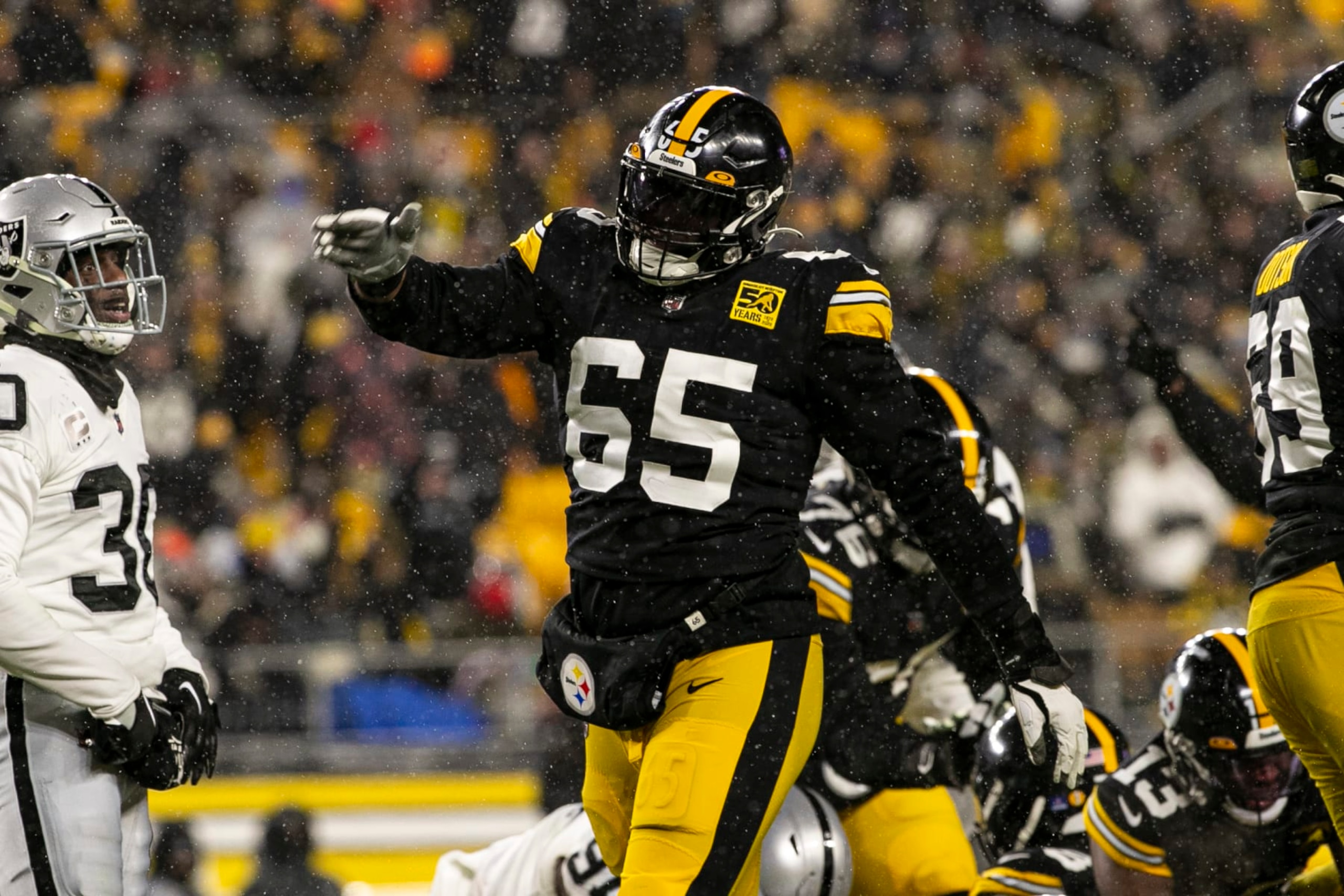 PITTSBURGH, PA - DECEMBER 24: Pittsburgh Steelers offensive tackle Dan Moore Jr. (65) celebrates during the national football league game between the Las Vegas Raiders and the Pittsburgh Steelers on December 24, 2022 at Acrisure Stadium in Pittsburgh, PA. (Photo by Mark Alberti/Icon Sportswire via Getty Images)