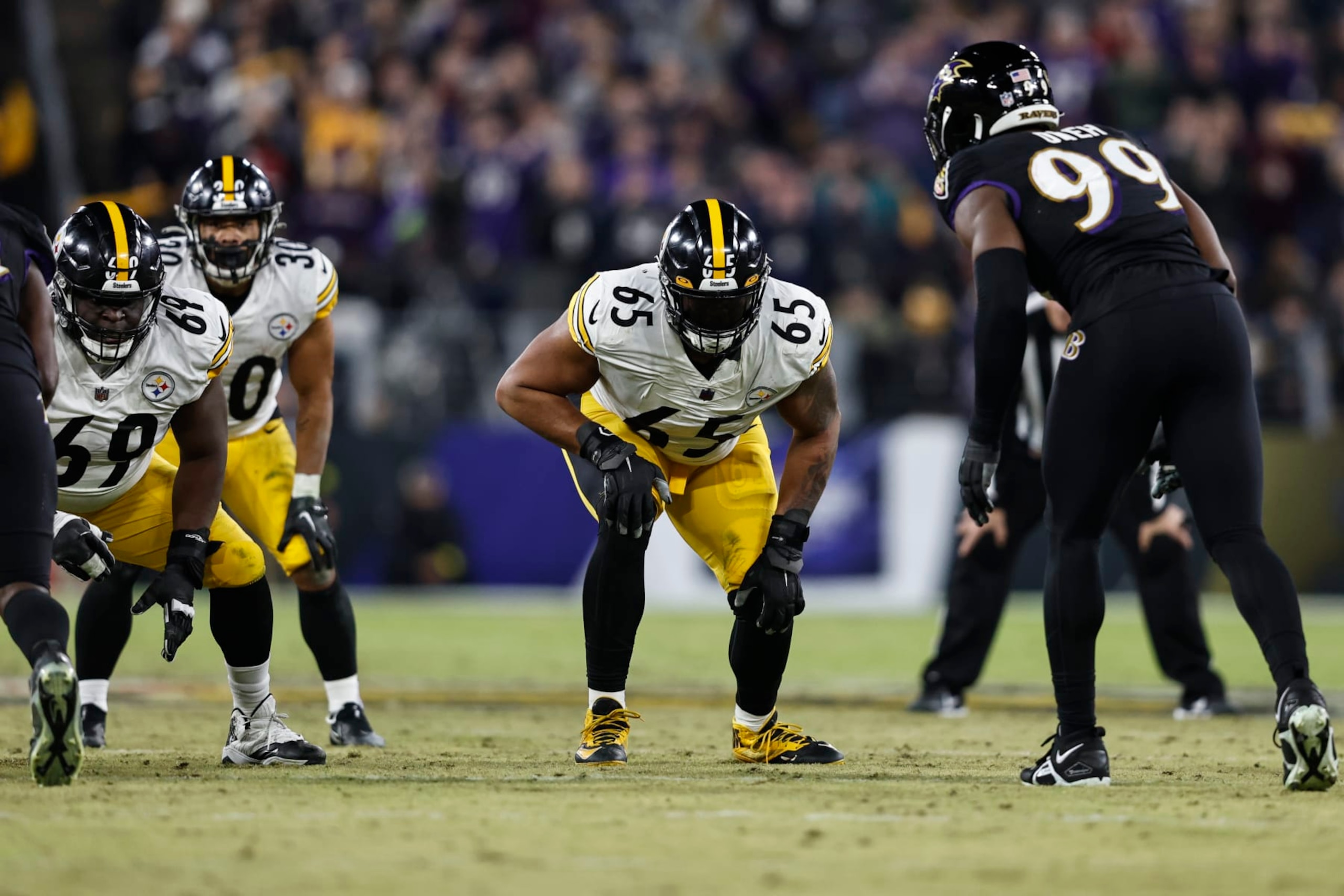 BALTIMORE, MARYLAND - JANUARY 01: Dan Moore Jr. #65 of the Pittsburgh Steelers lines up during an NFL football game between the Baltimore Ravens and the Pittsburgh Steelers at M&T Bank Stadium on January 01, 2023 in Baltimore, Maryland. (Photo by Michael Owens/Getty Images)