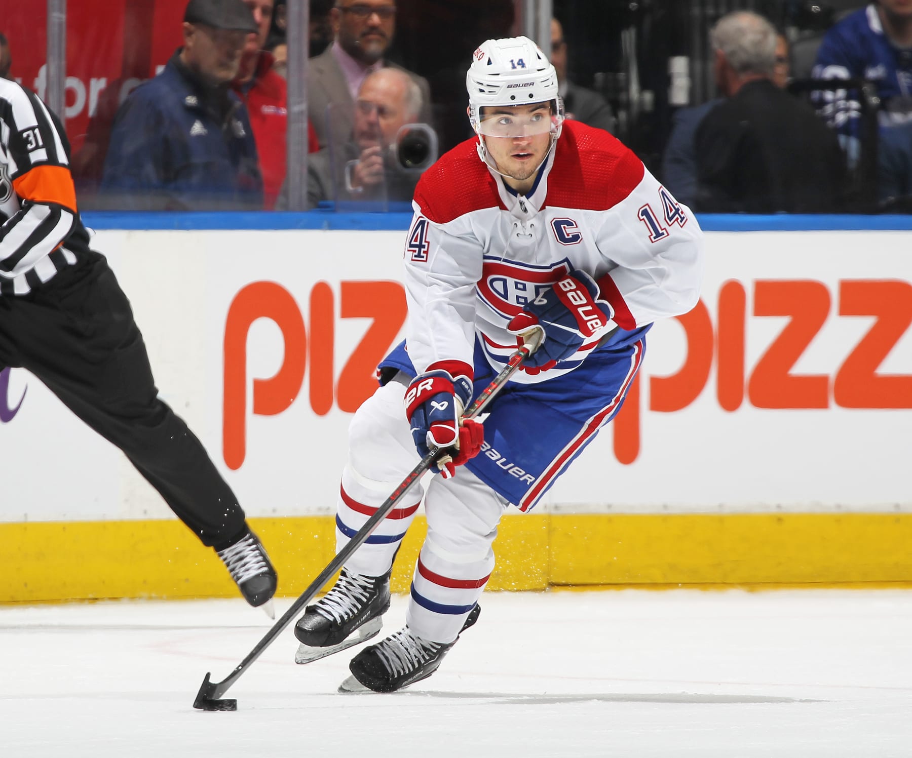TORONTO, CANADA - APRIL 8:  Nick Suzuki #14 of the Montreal Canadiens skates with the puck against the Toronto Maple Leafs during an NHL game at Scotiabank Arena on April 8, 2023 in Toronto, Ontario, Canada. The Maple Leafs defeated the Canadiens 7-1.(Photo by Claus Andersen/Getty Images)