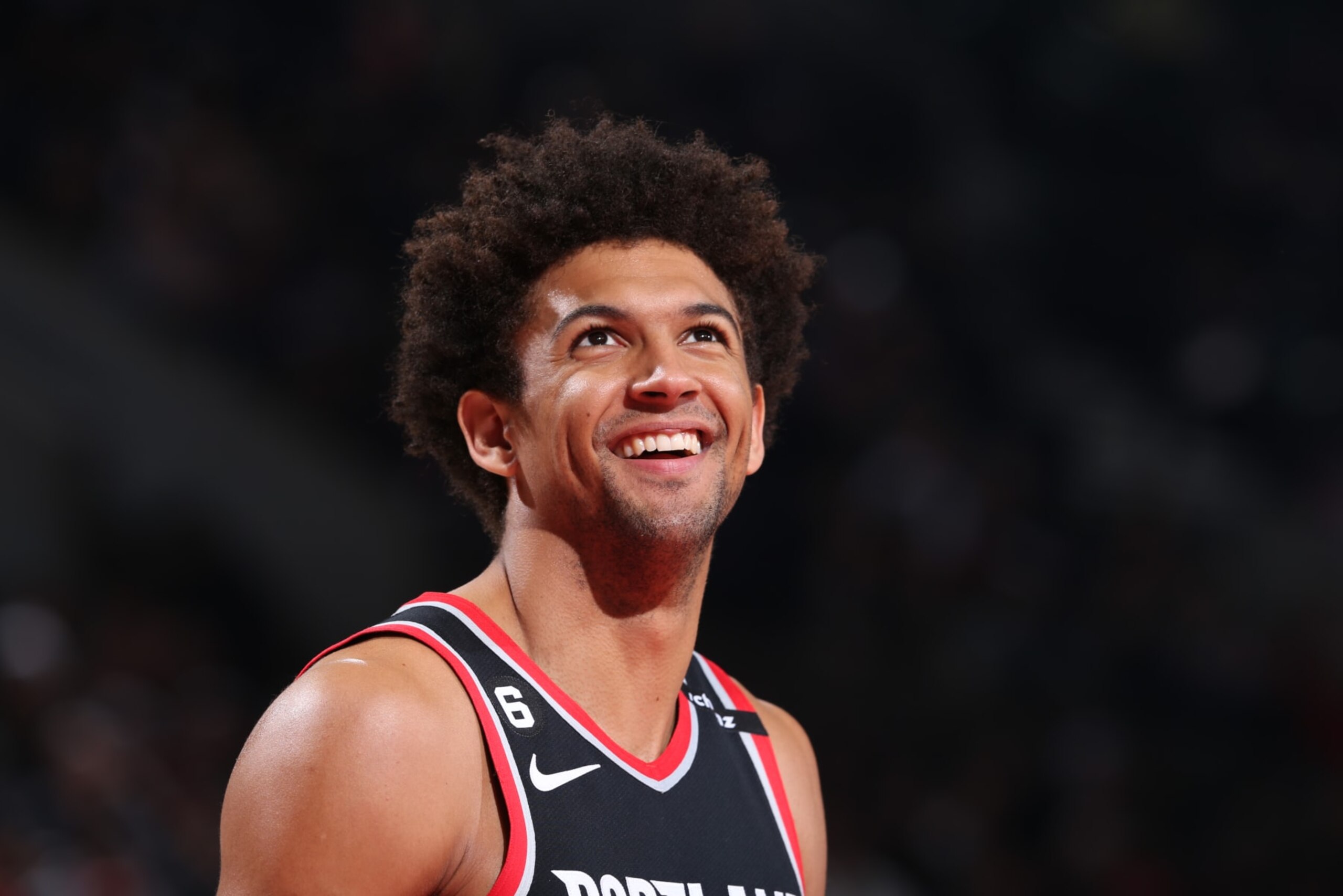 PORTLAND, OR - MARCH 31: Matisse Thybulle #4 of the Portland Trail Blazers smiles during the game against the Sacramento Kings on March 31, 2023 at the Moda Center Arena in Portland, Oregon. NOTE TO USER: User expressly acknowledges and agrees that, by downloading and or using this photograph, user is consenting to the terms and conditions of the Getty Images License Agreement. Mandatory Copyright Notice: Copyright 2023 NBAE (Photo by Sam Forencich/NBAE via Getty Images)