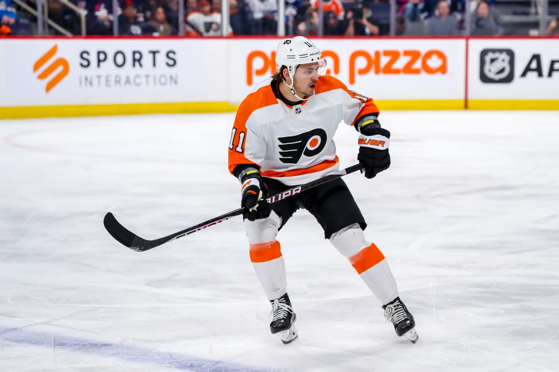 WINNIPEG, CANADA - JANUARY 28: Travis Konecny #11 of the Philadelphia Flyers keeps an eye on the play during first period action against the Winnipeg Jets at the Canada Life Centre on January 28, 2023 in Winnipeg, Manitoba, Canada. The Flyers shutout the Jets 4-0. (Photo by Darcy Finley/NHLI via Getty Images)