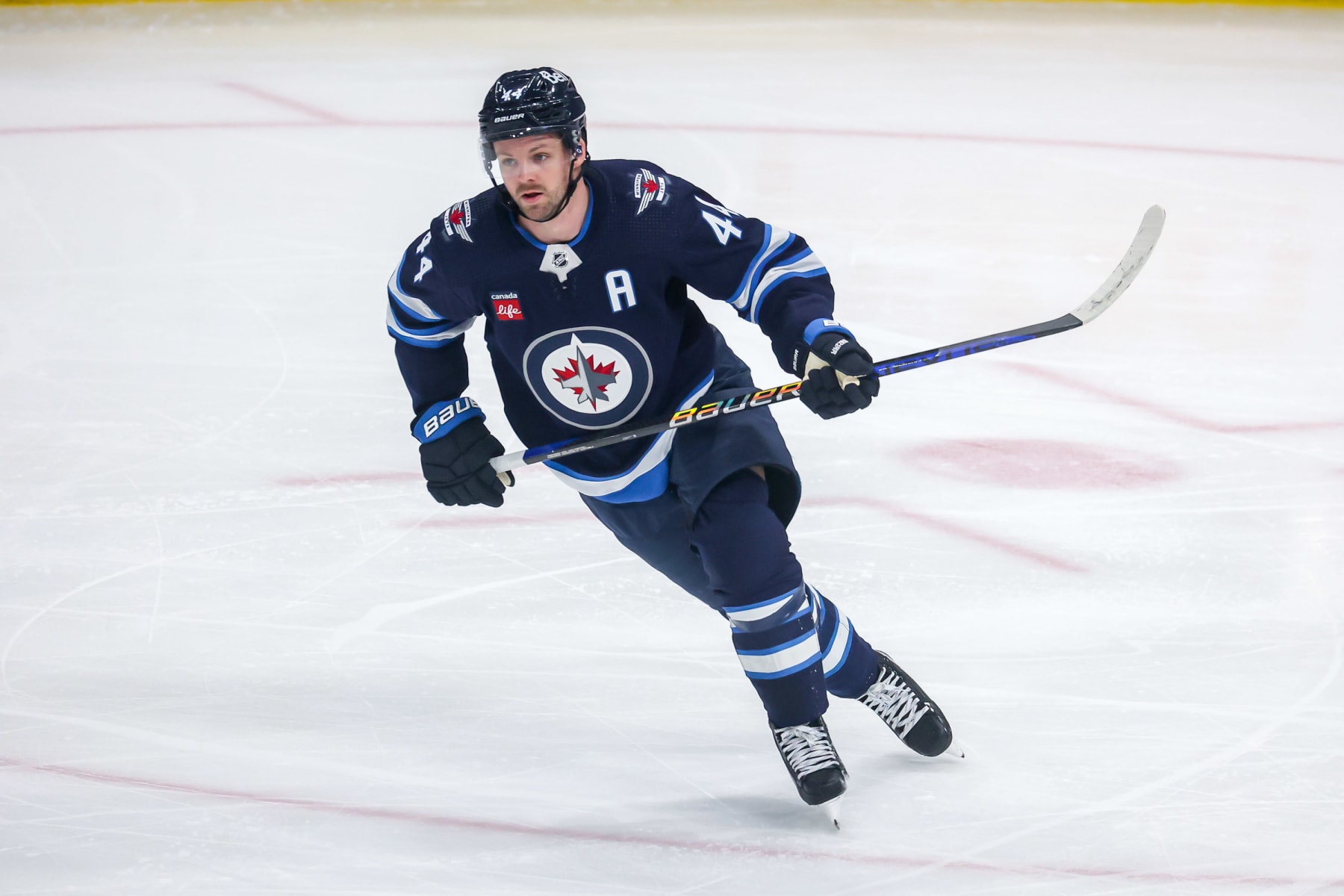 WINNIPEG, CANADA - APRIL 10: Josh Morrissey #44 of the Winnipeg Jets follows the play up the ice during first period action against the San Jose Sharks at the Canada Life Centre on April 10, 2023 in Winnipeg, Manitoba, Canada. This marks the 500th game of Morrissey's NHL career. (Photo by Jonathan Kozub/NHLI via Getty Images)