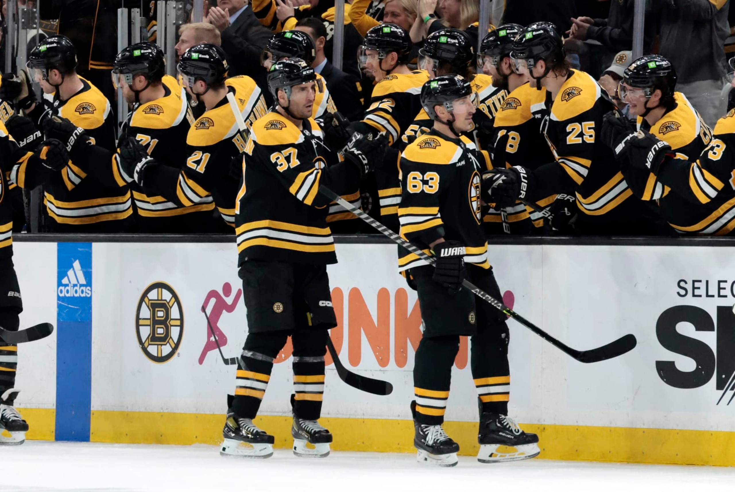 BOSTON, MA - APRIL 11: Boston Bruins left wing Brad Marchand (63) skates past the bench after breaking a long goal slump during a game between the Boston Bruins and the Washington Capitals on April 11, 2023, at TD Garden in Boston, Massachusetts. (Photo by Fred Kfoury III/Icon Sportswire via Getty Images)