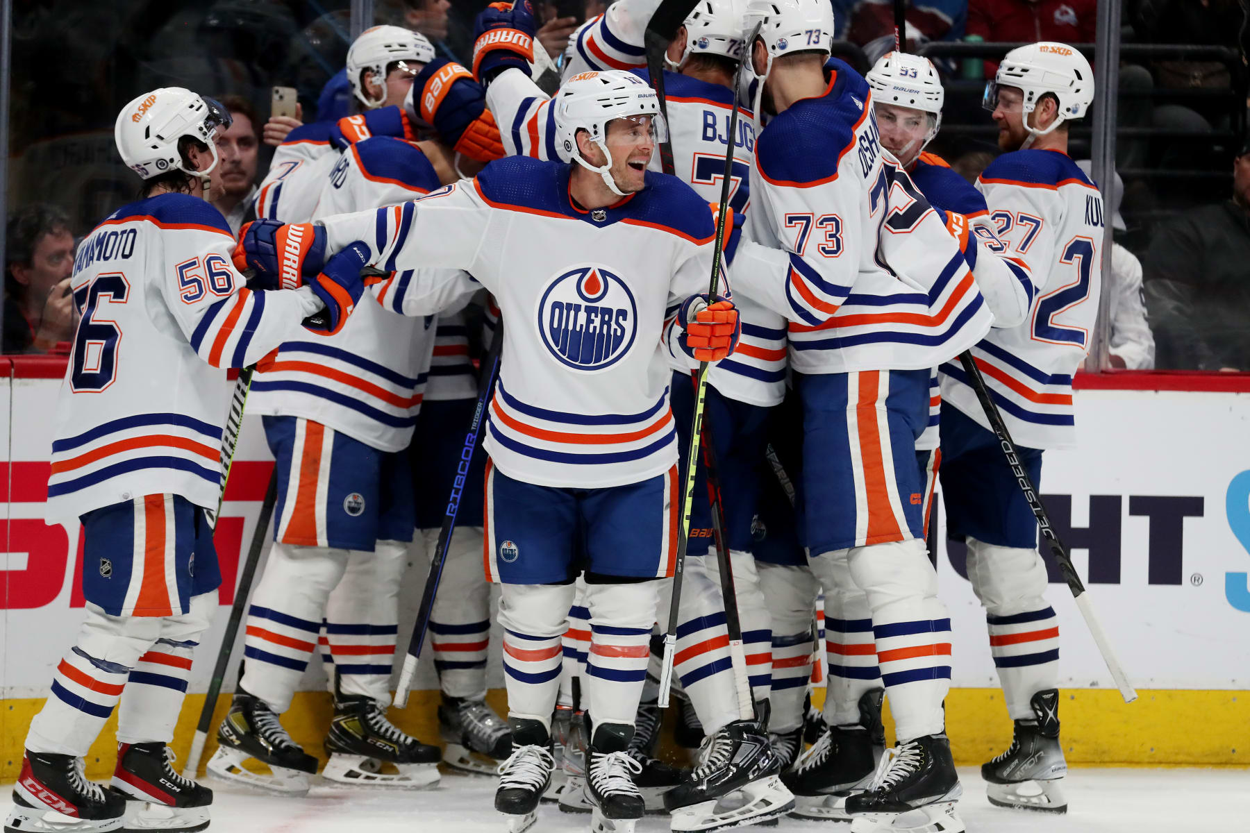 DENVER, COLORADO - APRIL 11: Kailer Yamamoto #56, Derek Ryan #10 and the Edmonton Oilers celebrate a 2-1 overtime win against the Colorado Avalanche at Ball Arena on April 11, 2023 in Denver, Colorado. (Photo by Michael Martin/NHLI via Getty Images)