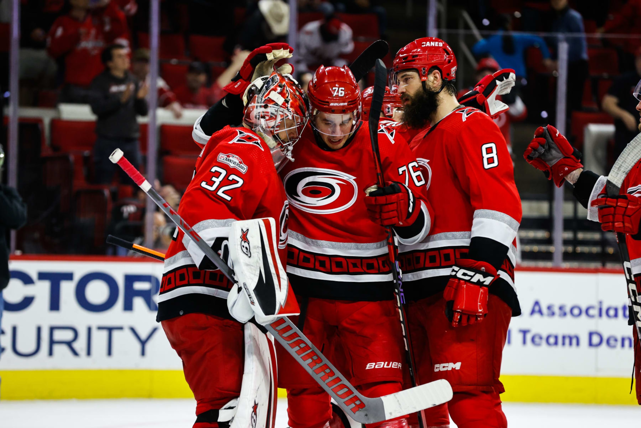 RALEIGH, NC - APRIL 11: Brady Skjei #76 of the Carolina Hurricanes and Antti Raanta celebrate a win after the third period of the game against the Detroit Red Wings at PNC Arena on April 11, 2023 in Raleigh, North Carolina. (Photo by Jaylynn Nash/Getty Images)
