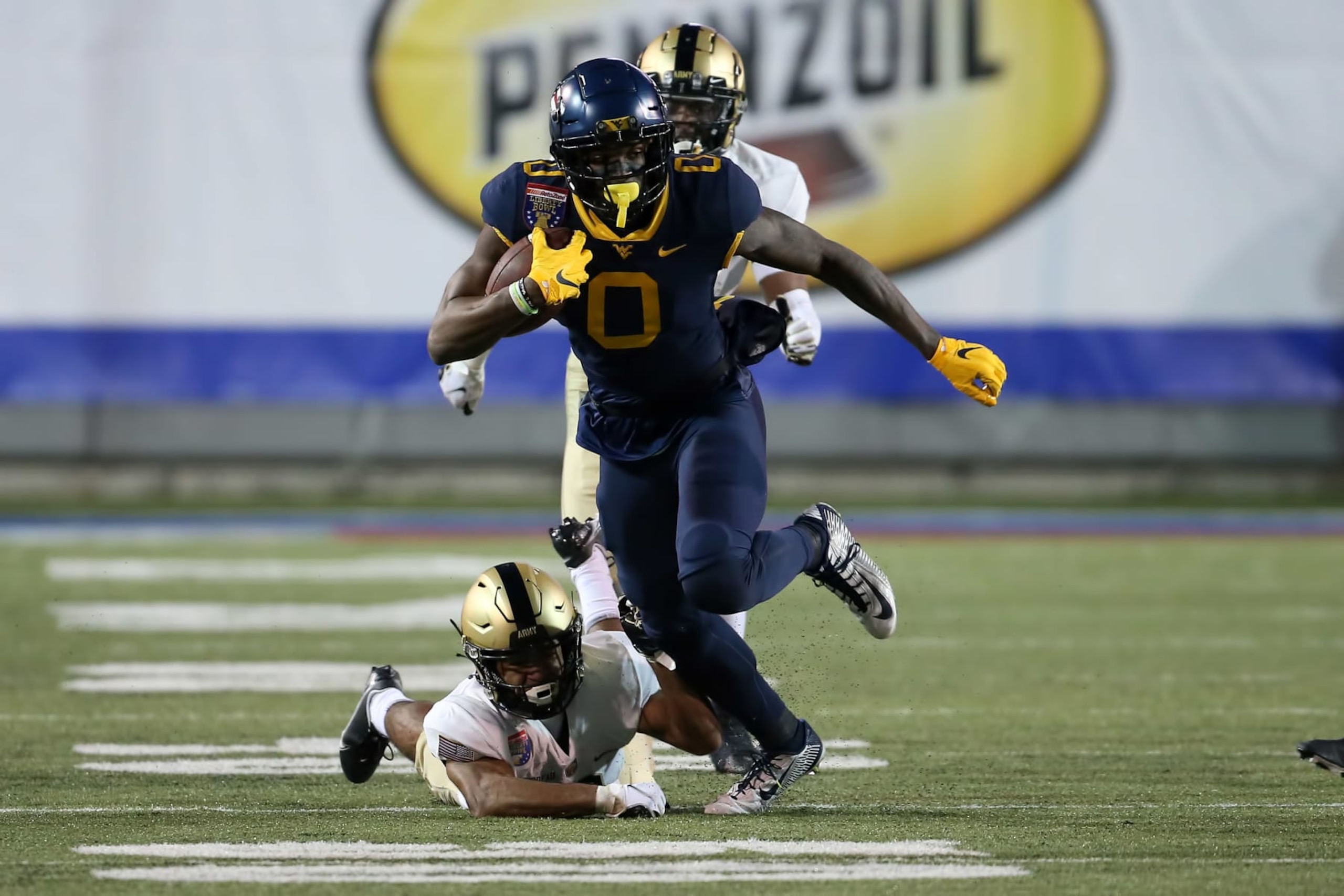 MEMPHIS, TN - DECEMBER 31: West Virginia Mountaineers wide receiver Bryce Ford-Wheaton (0) runs for extra yardage after a reception in the AutoZone Liberty Bowl between the Army Black Knights and the West Virginia Mountaineers on December 31, 2020 at the Liberty Bowl Memorial Stadium in Memphis, Tennessee.  (Photo by Michael Wade/Icon Sportswire via Getty Images)