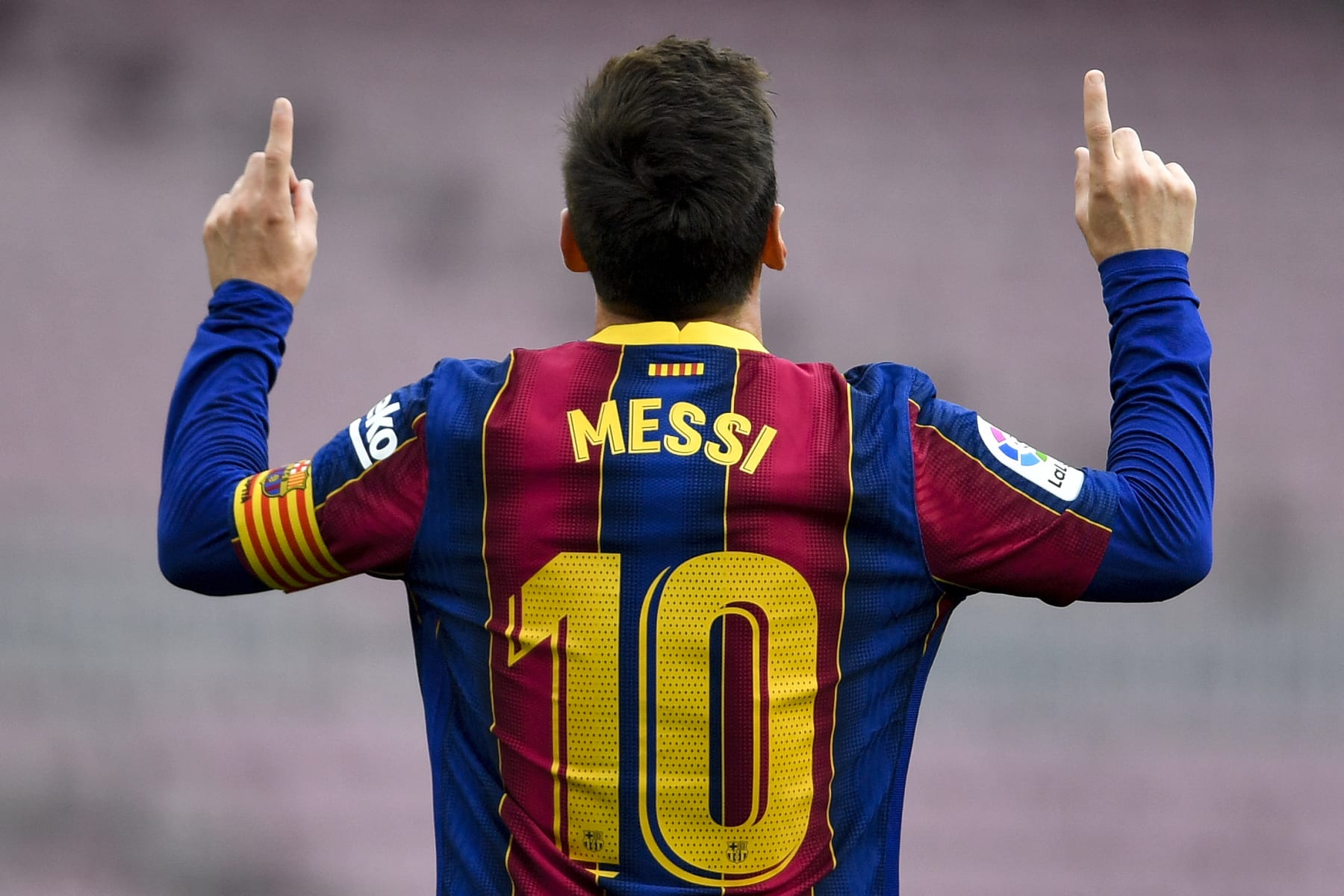 TOPSHOT - Barcelona's Argentine forward Lionel Messi celebrates after scoring a goal during the Spanish League football match between FC Barcelona  and RC Celta de Vigo at the Camp Nou stadium in Barcelona on May 16, 2021. (Photo by Pau BARRENA / AFP) (Photo by PAU BARRENA/AFP via Getty Images)