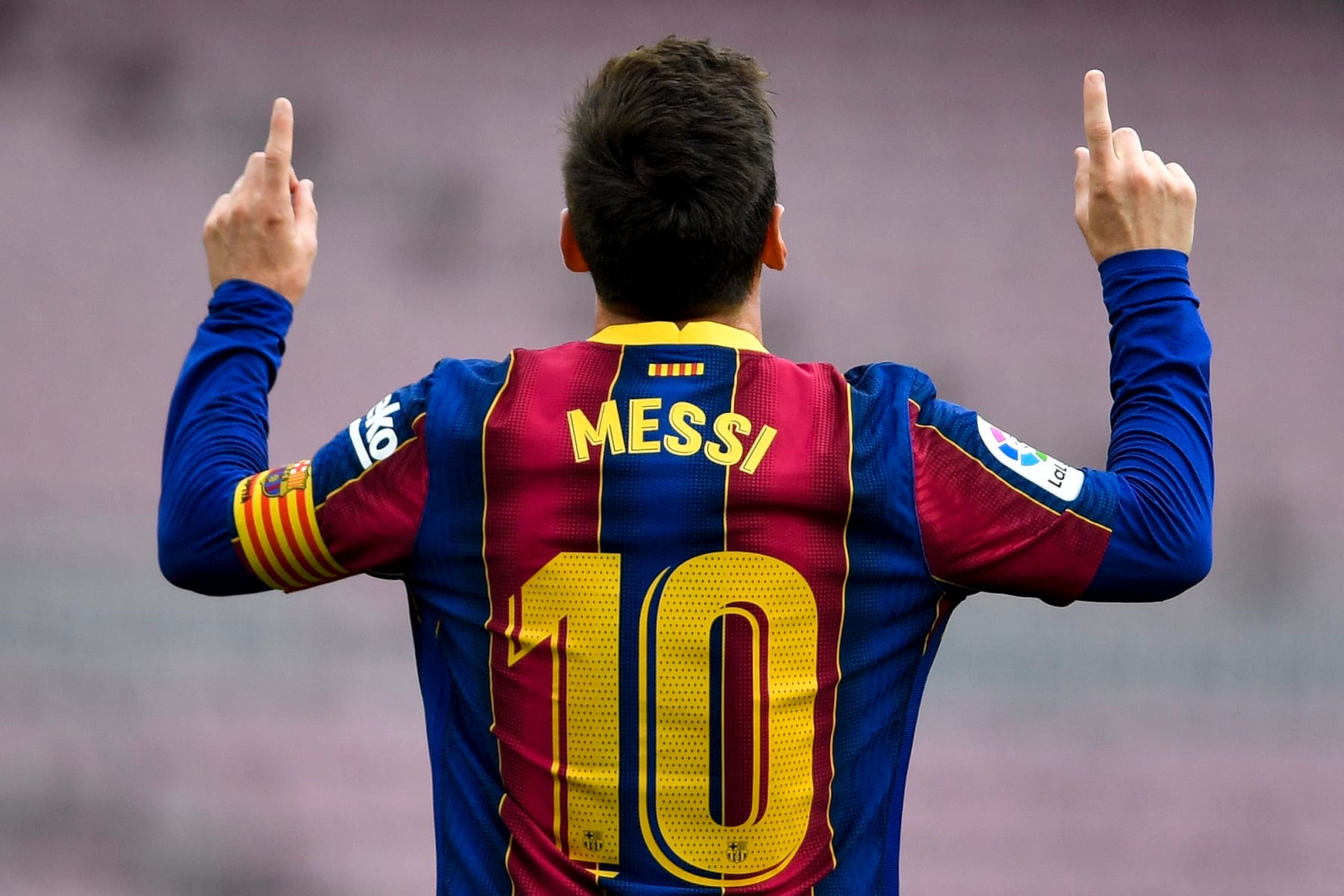 TOPSHOT - Barcelona's Argentine forward Lionel Messi celebrates after scoring a goal during the Spanish League football match between FC Barcelona  and RC Celta de Vigo at the Camp Nou stadium in Barcelona on May 16, 2021. (Photo by Pau BARRENA / AFP) (Photo by PAU BARRENA/AFP via Getty Images)