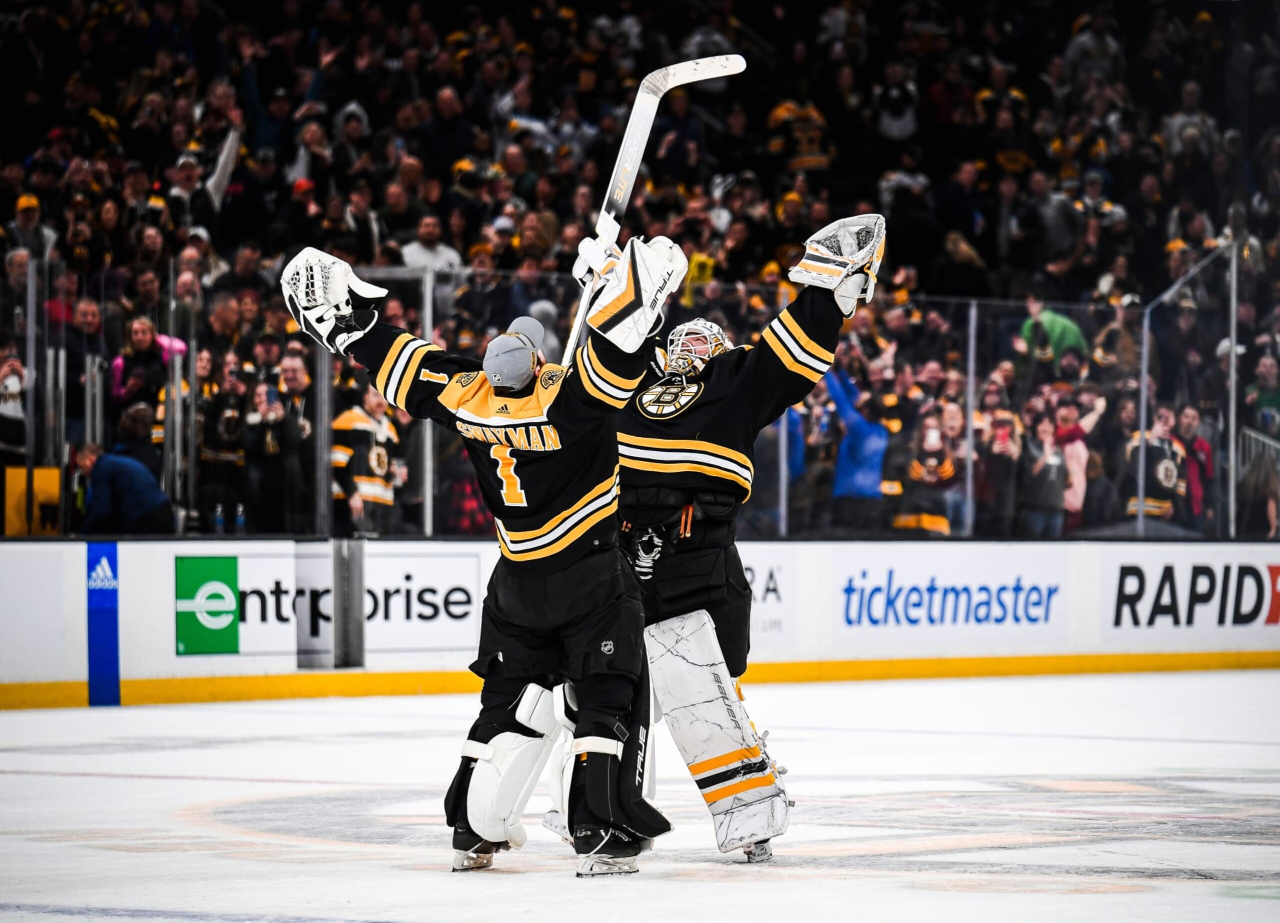 BOSTON, MASSACHUSETTS - MARCH 30: Jeremy Swayman #1 and Linus Ullmark #35 of the Boston Bruins celebrate an overtime win against the Columbus Blue Jackets at TD Garden on March 30, 2023 in Boston, Massachusetts. (Photo by China Wong/NHLI via Getty Images)