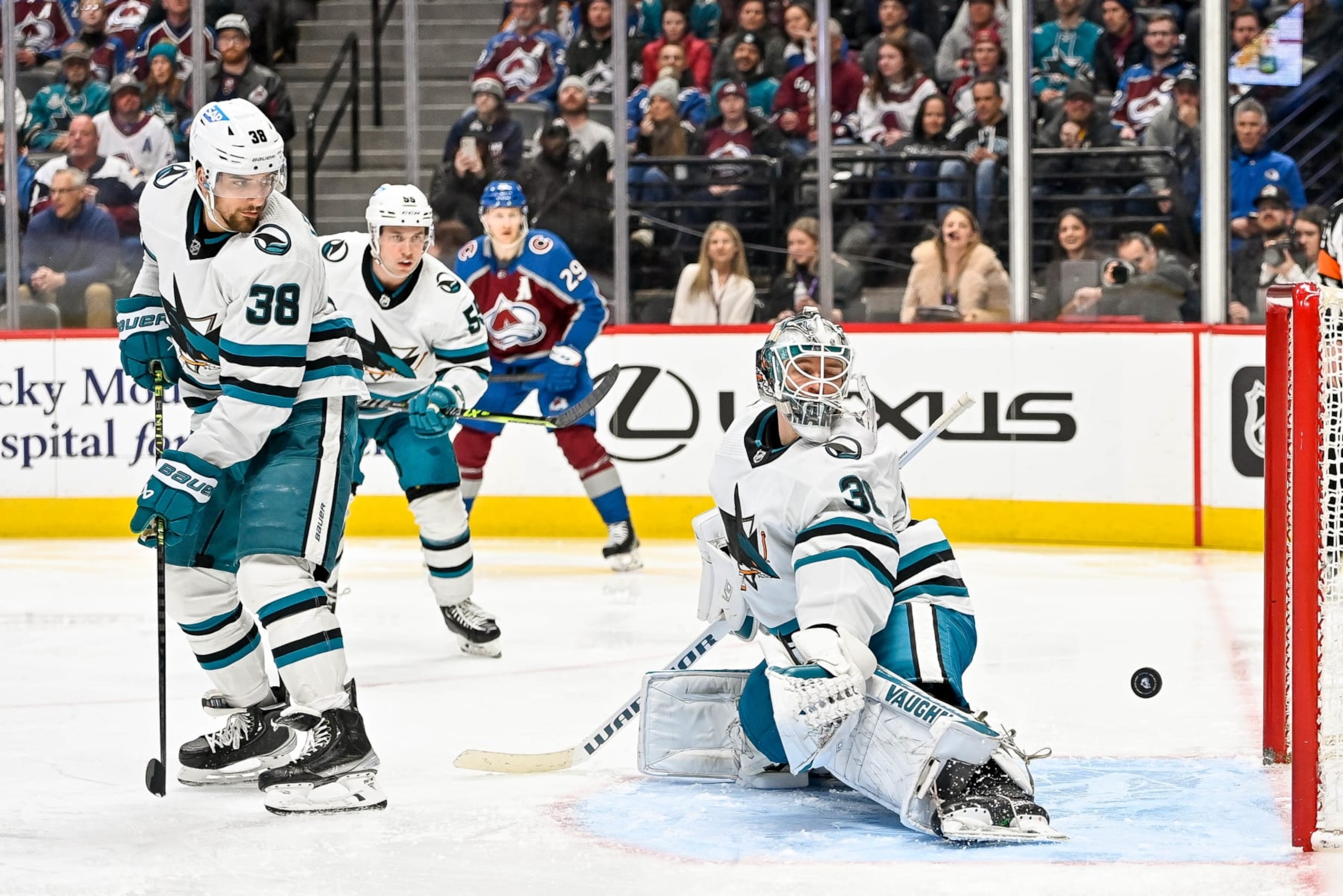 DENVER, COLORADO - MARCH 7:  Kaapo Kahkonen #36 of the San Jose Sharks watches as a puck flyes over his pad for a second period goal in a game against the Colorado Avalanche at Ball Arena on March 7, 2023 in Denver, Colorado. (Photo by Dustin Bradford/Getty Images)