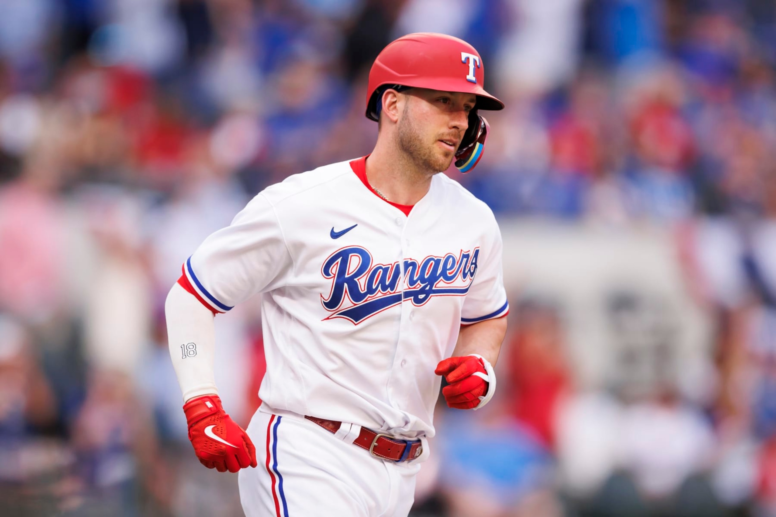 ARLINGTON, TX - APRIL 01: Mitch Garver #18 of the Texas Rangers rounds the bases after he hits his second three-run home run of the day during a game against the Philadelphia Phillies at Globe Life Field on April 1, 2023 in Arlington, Texas. (Photo by Bailey Orr/Texas Rangers/Getty Images)