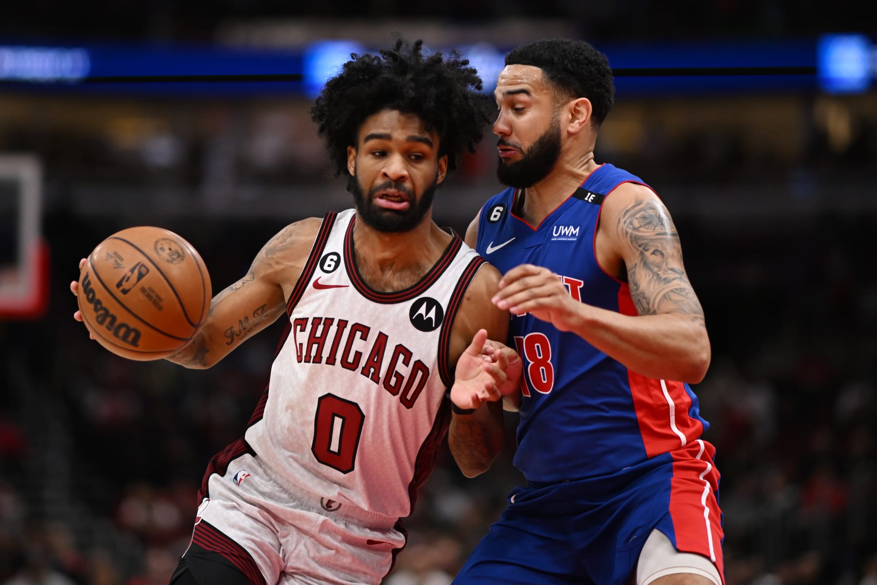 CHICAGO, ILLINOIS - APRIL 09: Coby White #0 of the Chicago Bulls drives with the basketball in the first half against Cory Joseph #18 of the Detroit Pistons at United Center on April 09, 2023 in Chicago, Illinois.   NOTE TO USER: User expressly acknowledges and agrees that, by downloading and or using this photograph, User is consenting to the terms and conditions of the Getty Images License Agreement.  (Photo by Quinn Harris/Getty Images)