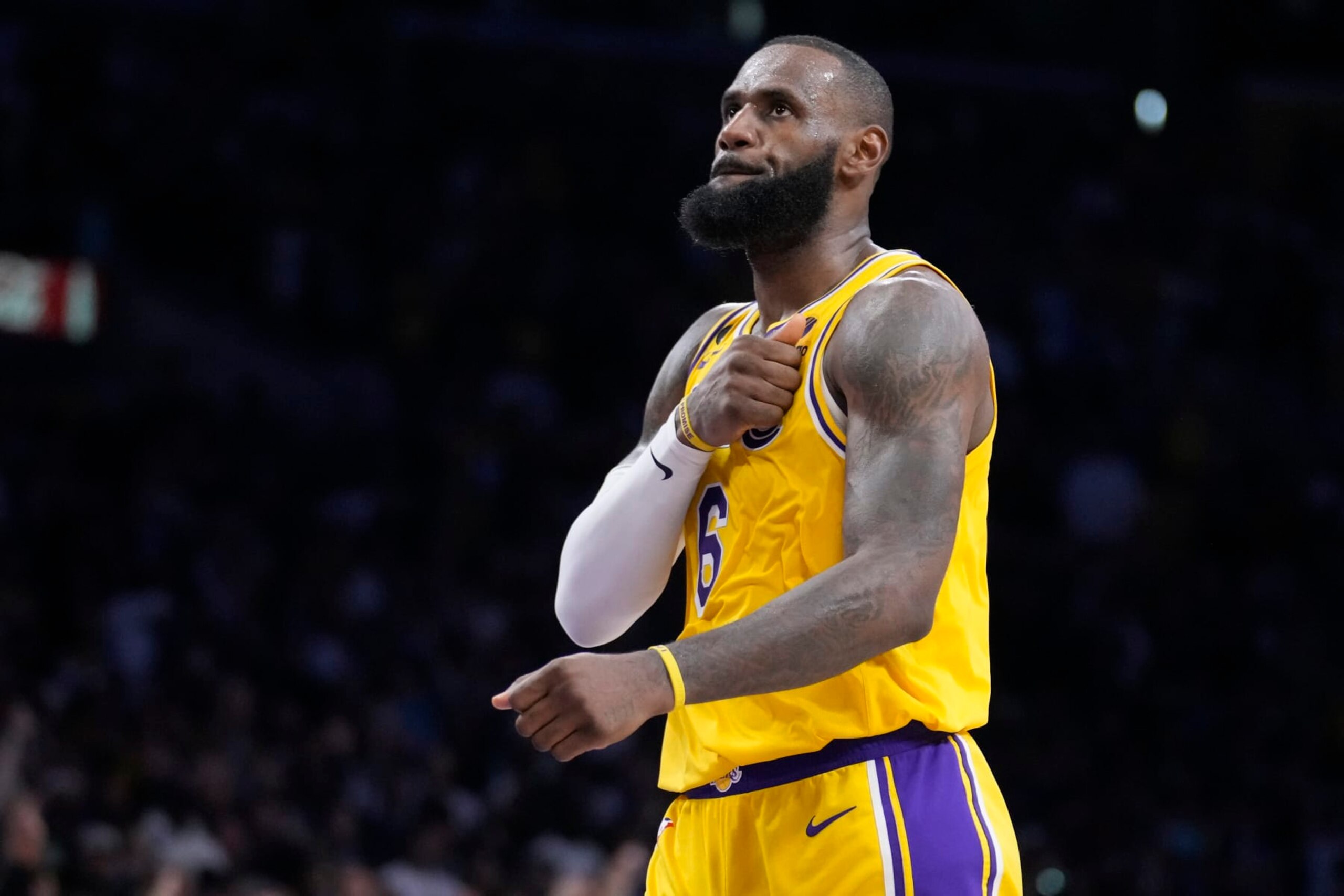 Los Angeles Lakers forward LeBron James reacts after scoring during the second half of an NBA basketball play-in tournament game against the Minnesota Timberwolves Tuesday, April 11, 2023, in Los Angeles. (AP Photo/Marcio Jose Sanchez)