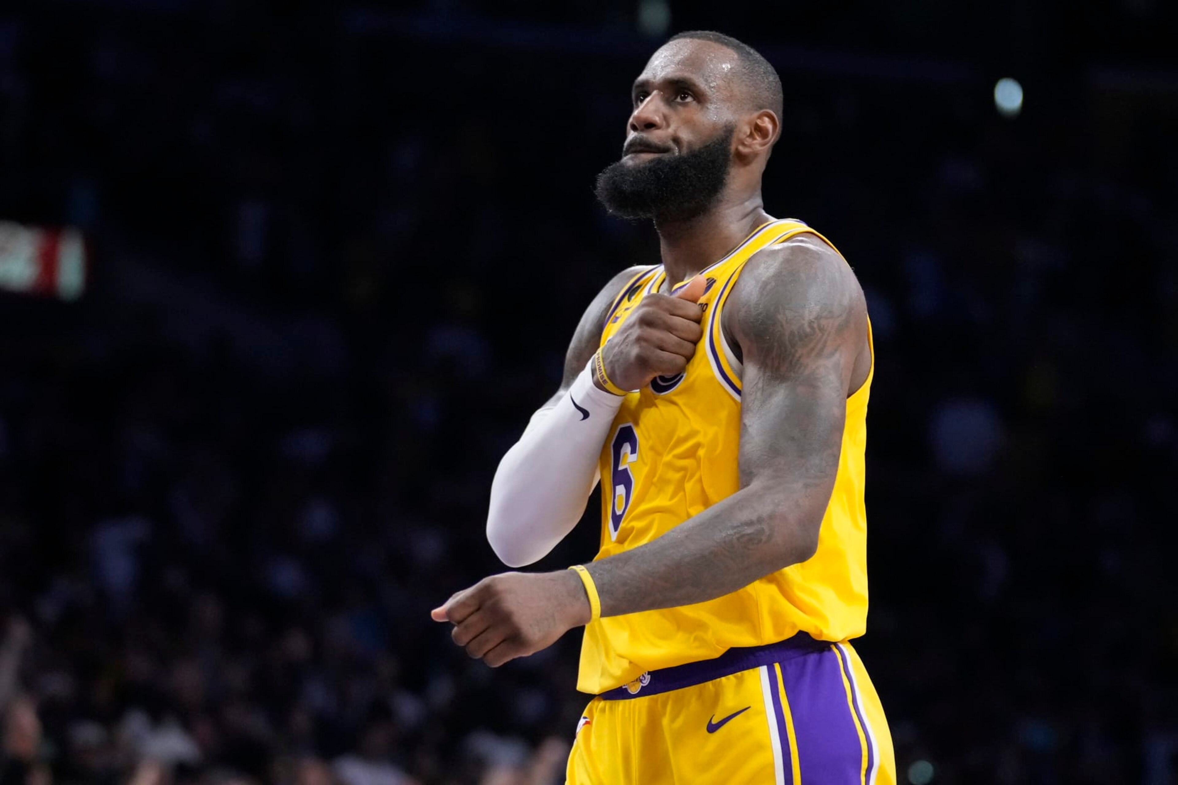 Los Angeles Lakers forward LeBron James reacts after scoring during the second half of an NBA basketball play-in tournament game against the Minnesota Timberwolves Tuesday, April 11, 2023, in Los Angeles. (AP Photo/Marcio Jose Sanchez)