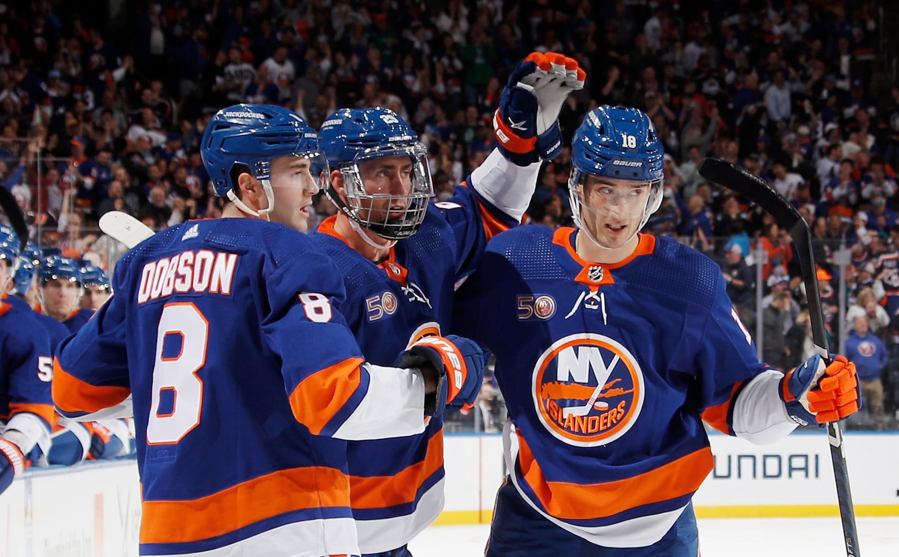 ELMONT, NEW YORK - APRIL 12: (L-R) Noah Dobson #8, Brock Nelson #29 and Pierre Engvall #18 of the New York Islanders celebrate Nelson's second period goal against the Montreal Canadiens at the UBS Arena on April 12, 2023 in Elmont, New York. (Photo by Bruce Bennett/Getty Images)