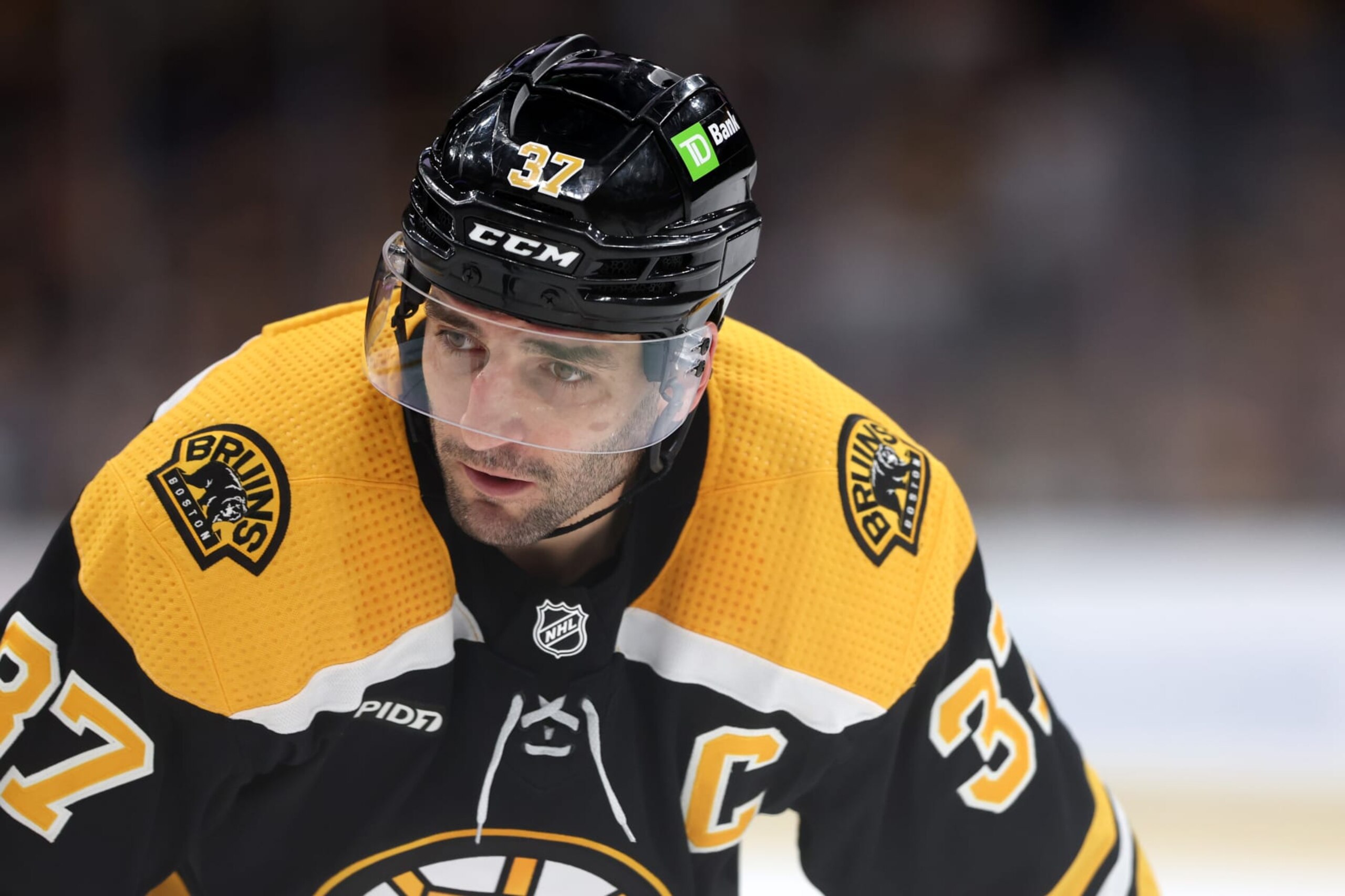 BOSTON, MASSACHUSETTS - APRIL 11: Patrice Bergeron #37 of the Boston Bruins looks on during the third period against the Boston Bruins at TD Garden on April 11, 2023 in Boston, Massachusetts. The Bruins defeat the Capitals 5-2, setting the new NHL record for most points in a single season with 133. (Photo by Maddie Meyer/Getty Images) BOSTON, MASSACHUSETTS - APRIL 11: Patrice Bergeron #37 of the Boston Bruins looks on during the third period against the Boston Bruins at TD Garden on April 11, 2023 in Boston, Massachusetts. The Bruins defeat the Capitals 5-2, setting the new NHL record for most points in a single season with 133. (Photo by Maddie Meyer/Getty Images)