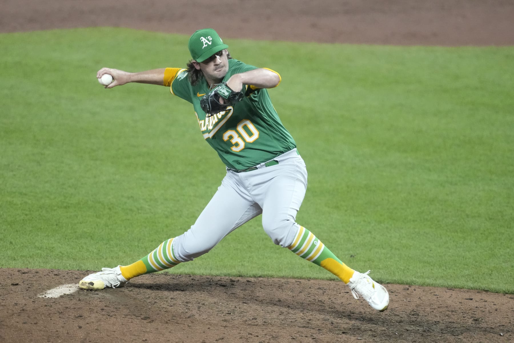 BALTIMORE MARYLAND - APRIL 12:  Chad Smith #30 of the Oakland Athletics pitches in the ninth for his first career win during a baseball game against the Baltimore Orioles at Oriole Park at Camden Yards on April 12, 2023 in Baltimore, Maryland.  (Photo by Mitchell Layton/Getty Images)