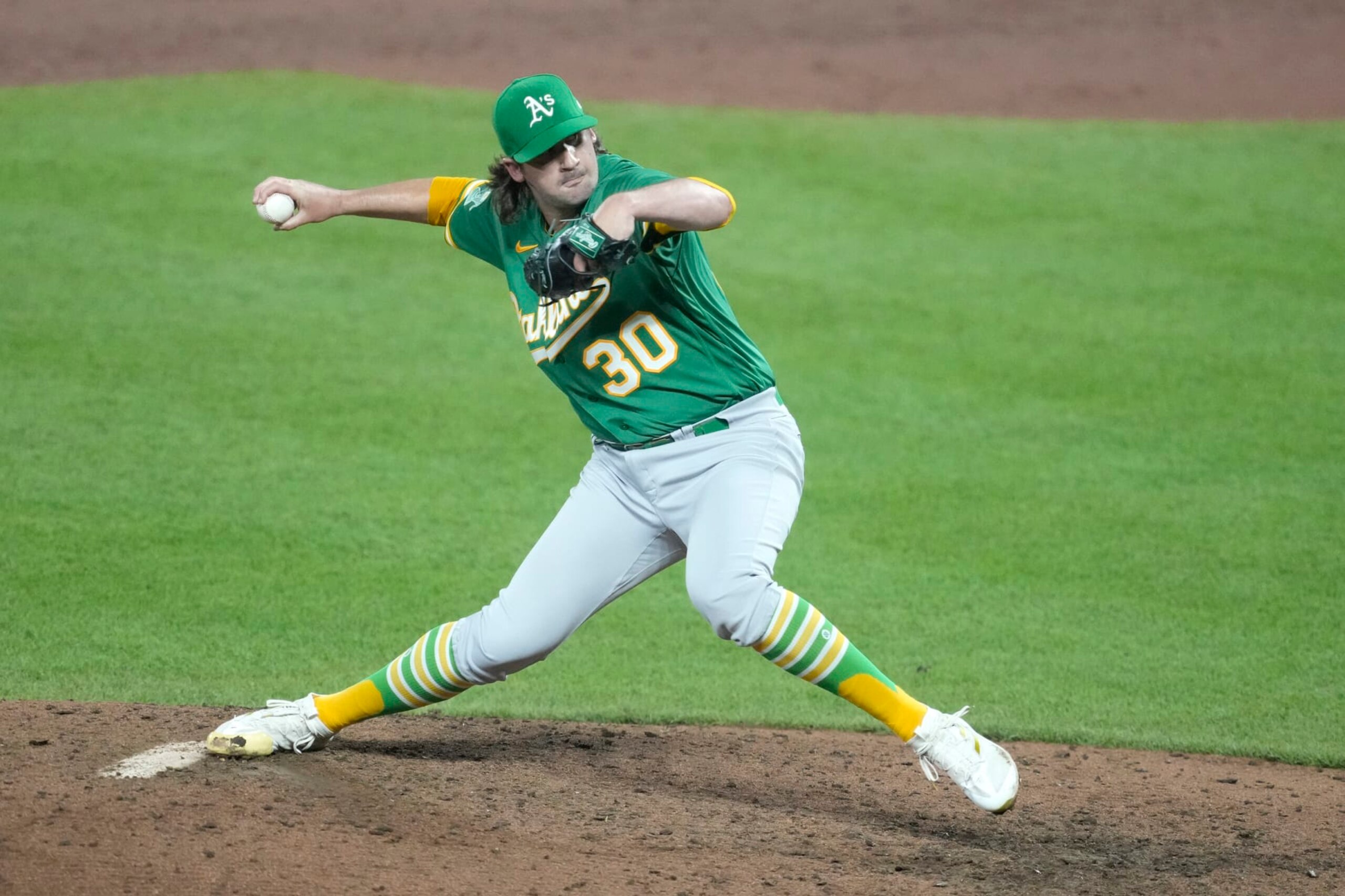 BALTIMORE MARYLAND - APRIL 12:  Chad Smith #30 of the Oakland Athletics pitches in the ninth for his first career win during a baseball game against the Baltimore Orioles at Oriole Park at Camden Yards on April 12, 2023 in Baltimore, Maryland.  (Photo by Mitchell Layton/Getty Images)