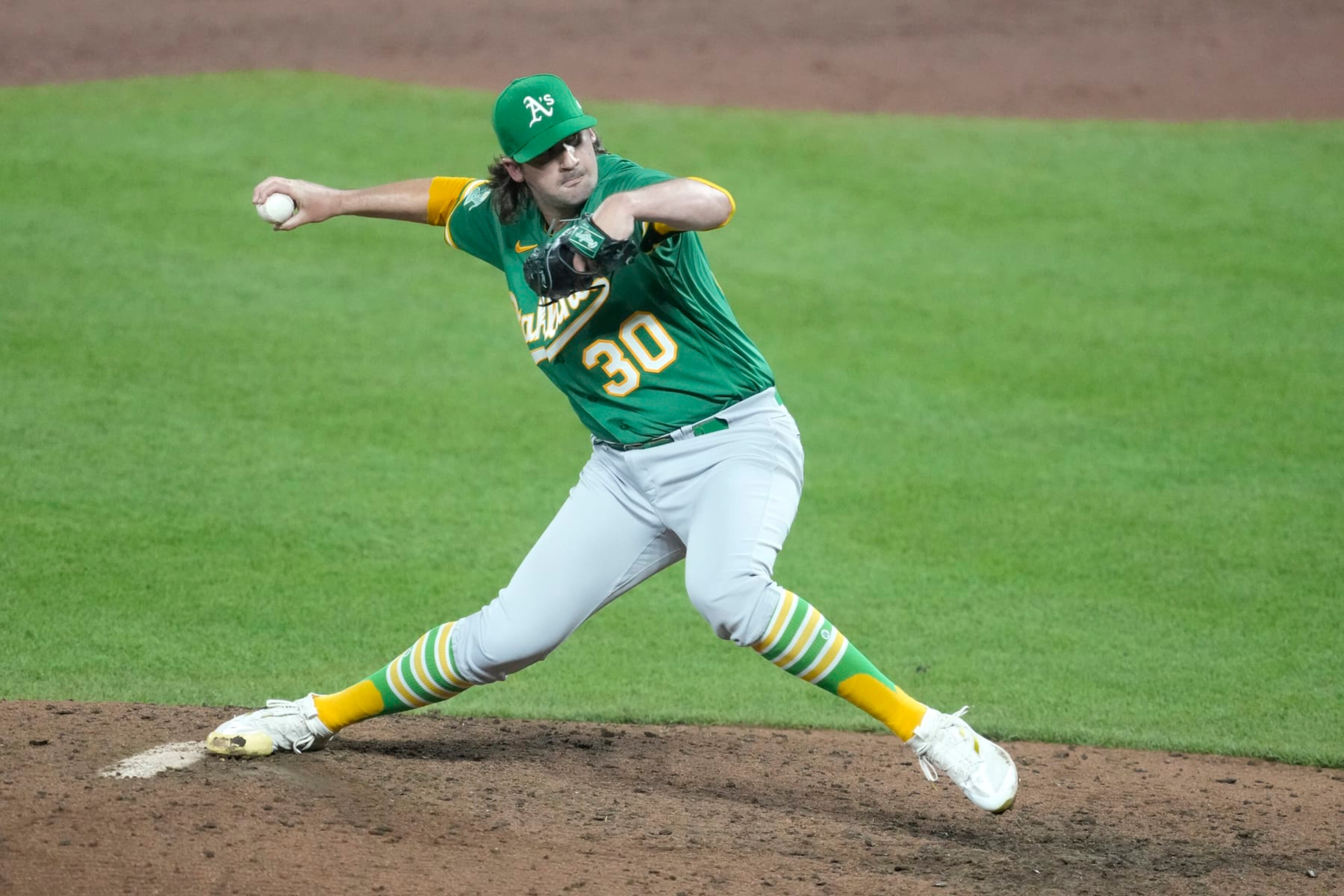 BALTIMORE MARYLAND - APRIL 12: Chad Smith #30 of the Oakland Athletics pitches in the ninth for his first career win during a baseball game against the Baltimore Orioles at Oriole Park at Camden Yards on April 12, 2023 in Baltimore, Maryland. (Photo by Mitchell Layton/Getty Images) BALTIMORE MARYLAND - APRIL 12: Chad Smith #30 of the Oakland Athletics pitches in the ninth for his first career win during a baseball game against the Baltimore Orioles at Oriole Park at Camden Yards on April 12, 2023 in Baltimore, Maryland. (Photo by Mitchell Layton/Getty Images)