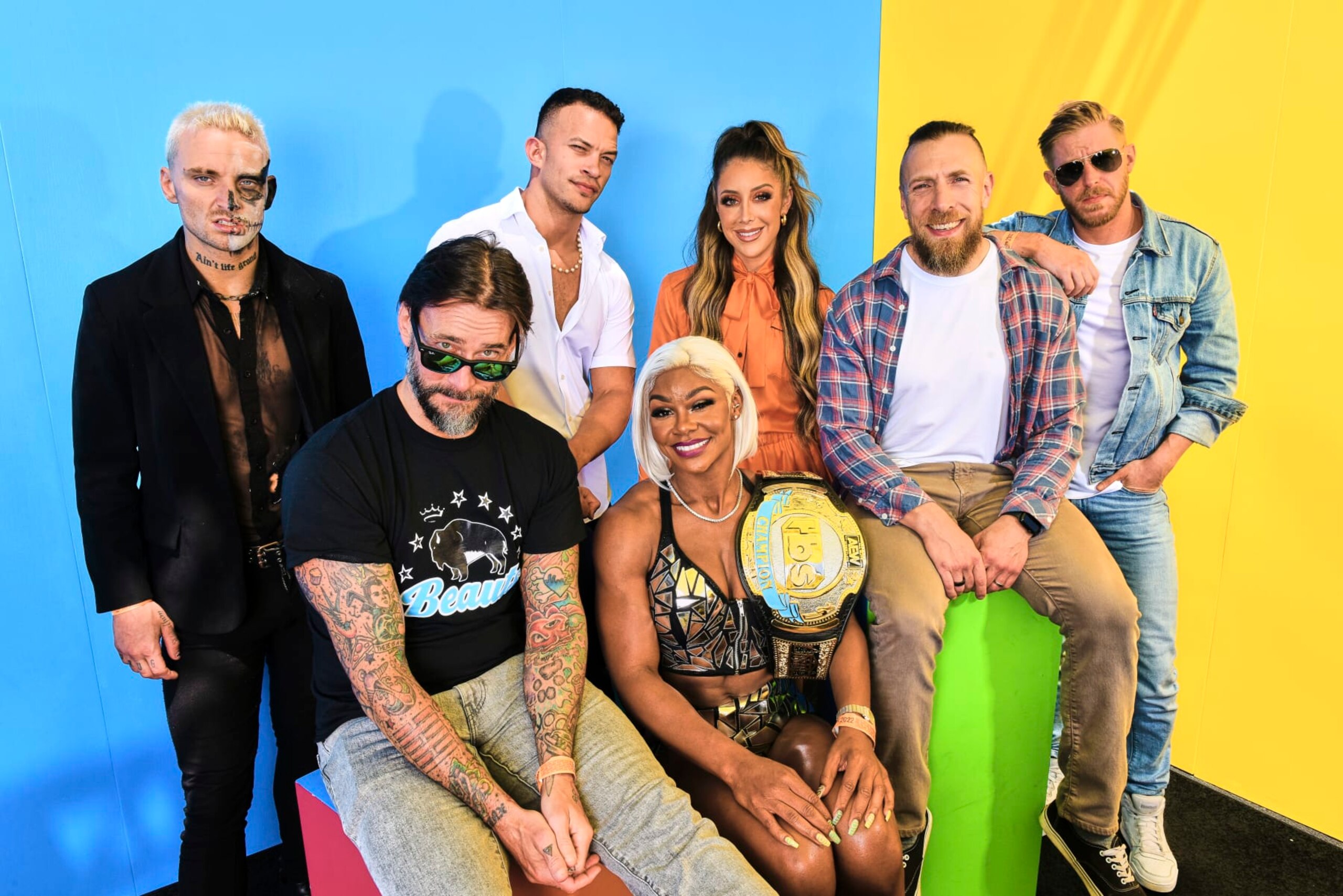 SAN DIEGO, CALIFORNIA - JULY 23: (L-R) Darby Allin, CM Punk, Ricky Starks, Jade Cargill, Britt Baker, Bryan Danielson, and Orange Cassidy visit the #IMDboat official portrait studio at San Diego Comic-Con 2022 on The IMDb Yacht on July 23, 2022 in San Diego, California. (Photo by Irvin Rivera/Getty Images for IMDb)