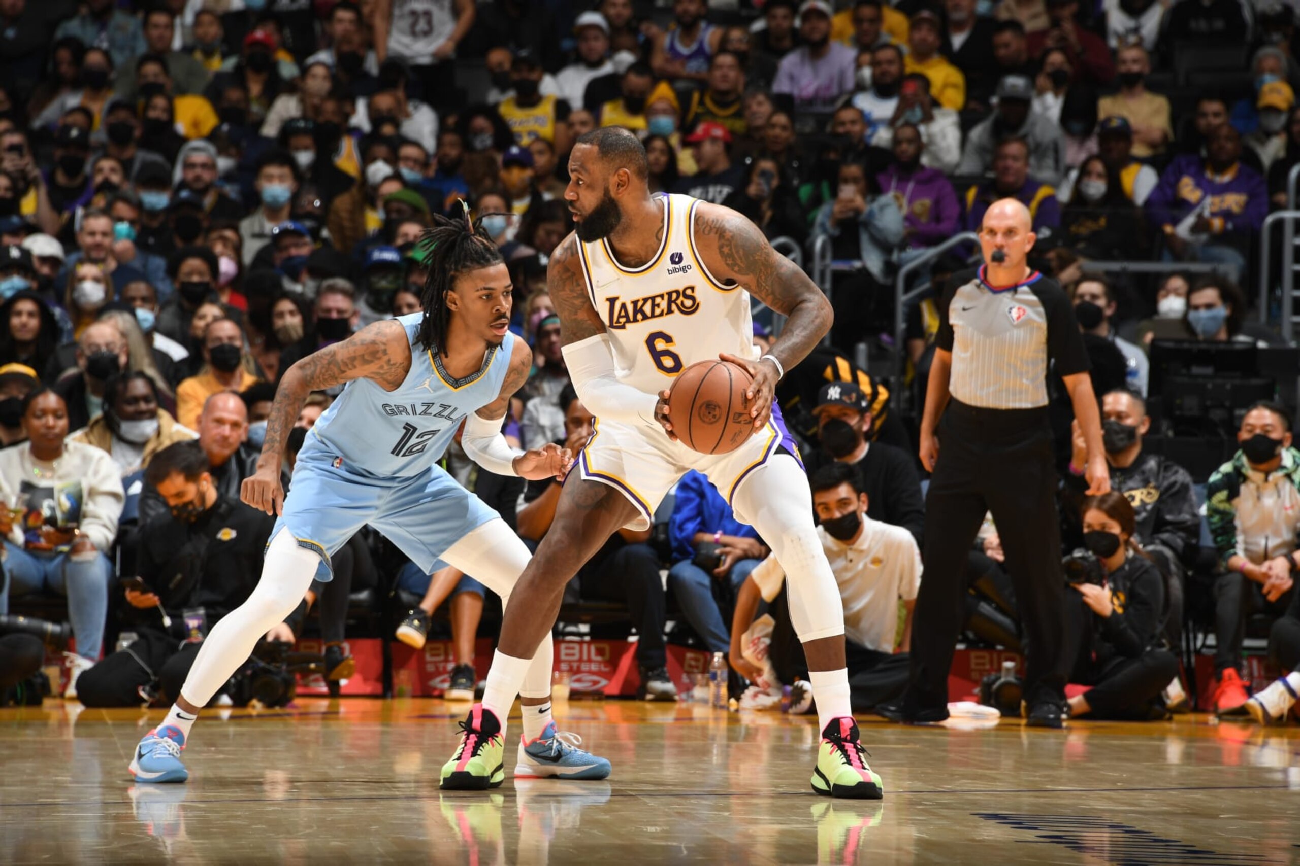 LOS ANGELES, CA - JANUARY 9: Ja Morant #12 of the Memphis Grizzlies plays defense on LeBron James #6 of the Los Angeles Lakers during the game on January 9, 2022 at Crypto.Com Arena in Los Angeles, California. NOTE TO USER: User expressly acknowledges and agrees that, by downloading and/or using this Photograph, user is consenting to the terms and conditions of the Getty Images License Agreement. Mandatory Copyright Notice: Copyright 2021 NBAE (Photo by Andrew D. Bernstein/NBAE via Getty Images)