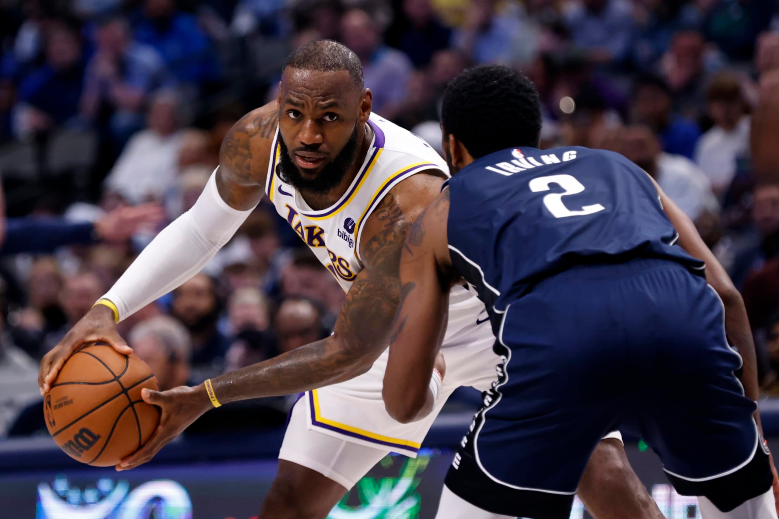DALLAS, TX - FEBRUARY 26 :  LeBron James #6 of the Los Angeles Lakers handles the ball against Kyrie Irving #2 of the Dallas Mavericks at American Airlines Center on February 26, 2023 in Dallas, Texas. NOTE TO USER: User expressly acknowledges and agrees that, by downloading and or using this photograph, User is consenting to the terms and conditions of the Getty Images License Agreement. (Photo by Ron Jenkins/Getty Images)
