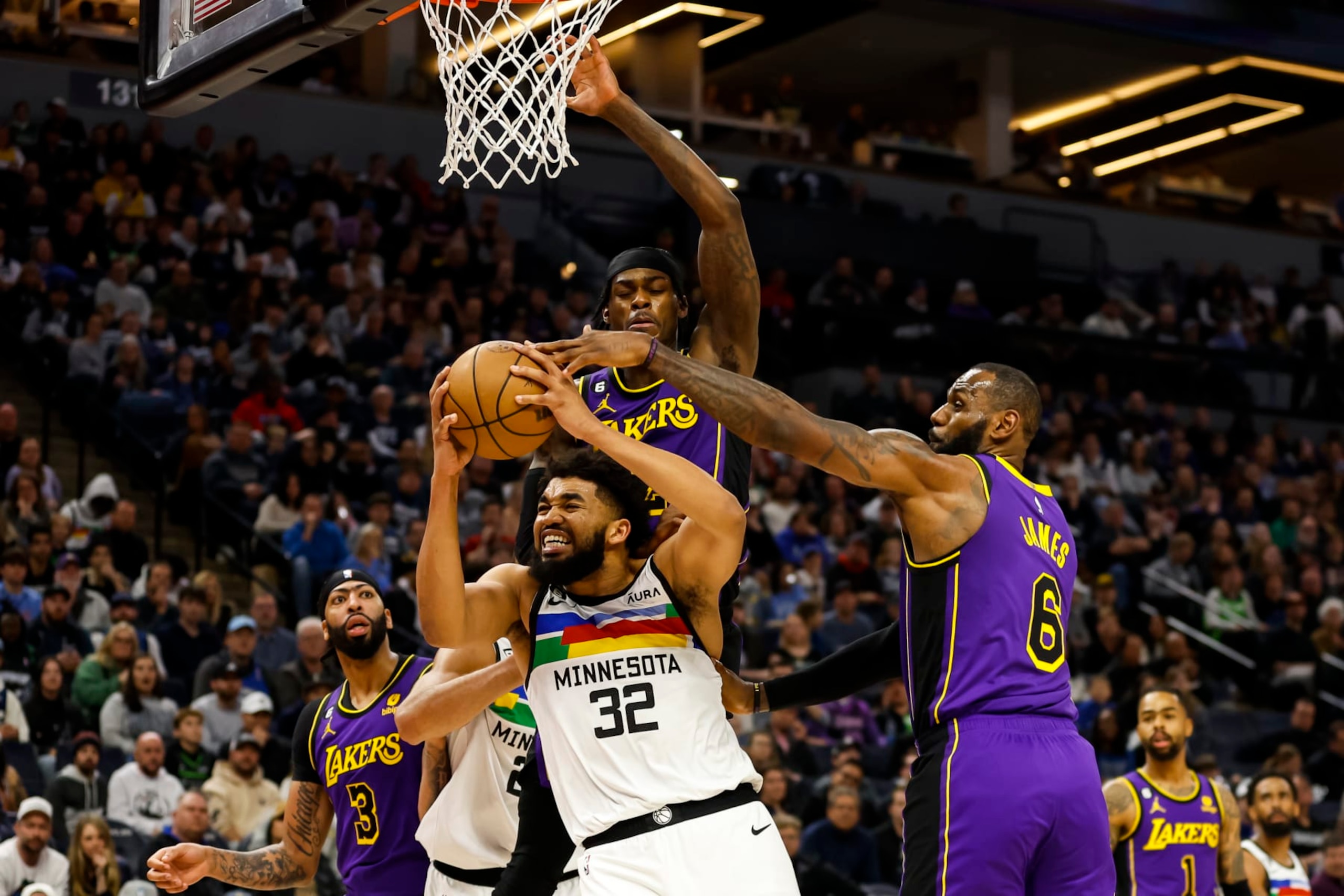Jarred Vanderbilt and LeBron James defending Karl-Anthony Towns