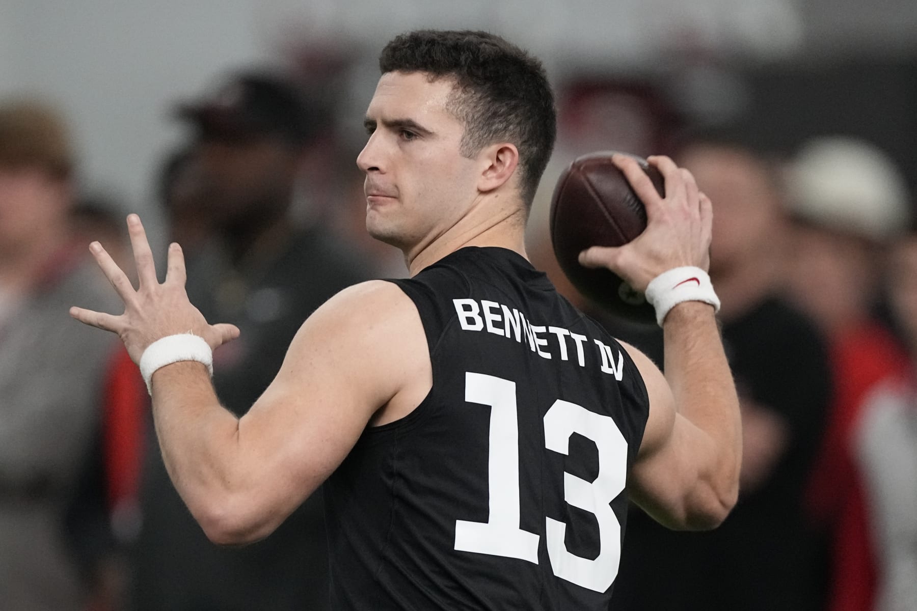 Former Georgia quarterback Stetson Bennett throws during drills at Georgia football Pro Day, Wednesday, March 15, 2023, in Athens, Ga. (AP Photo/John Bazemore)