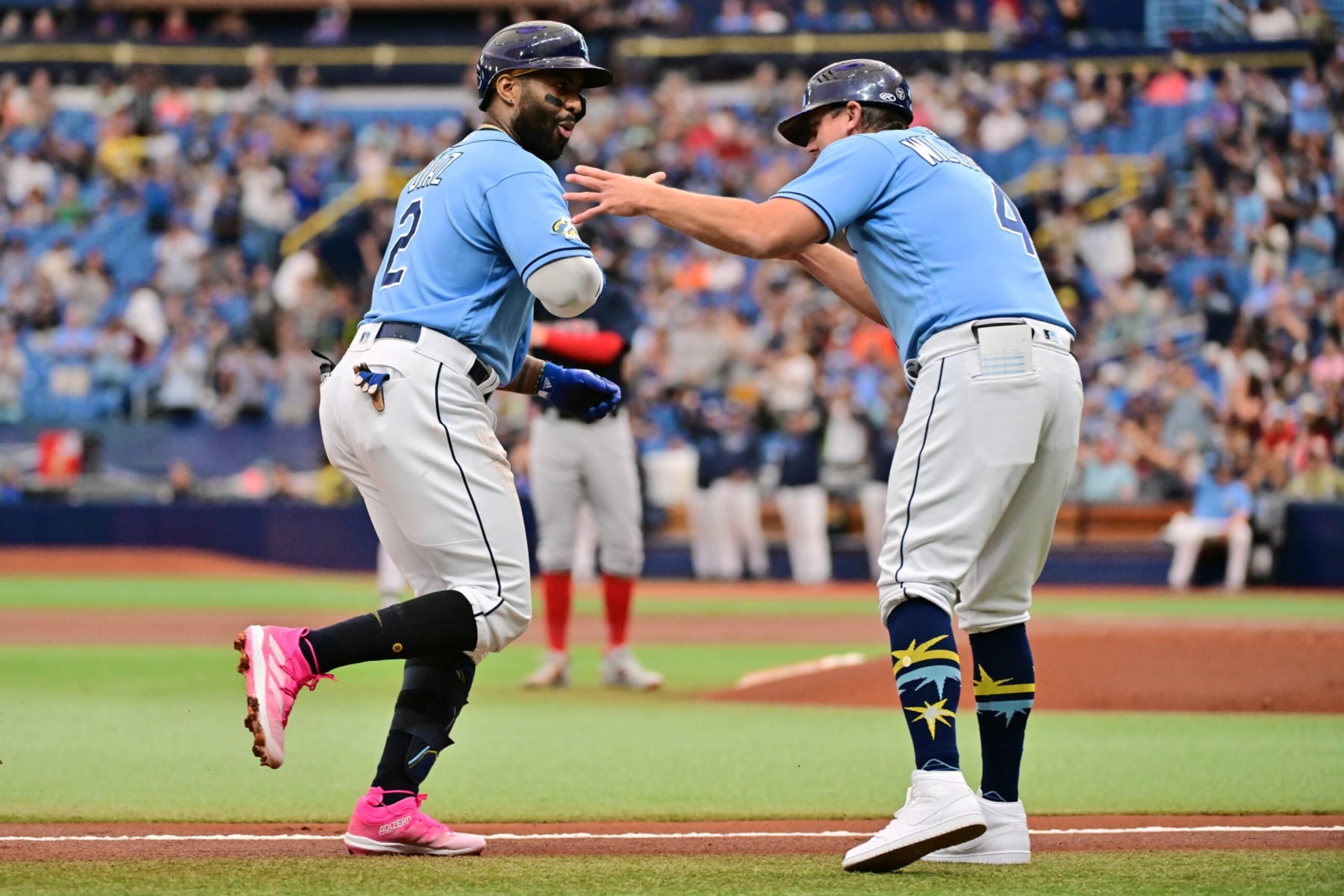 ST PETERSBURG, FLORIDA - APRIL 13: Yandy Diaz #2 celebrates with third base coach Brady Williams #4 of the Tampa Bay Rays after hitting a home run in the first inning against the Boston Red Sox at Tropicana Field on April 13, 2023 in St Petersburg, Florida. (Photo by Julio Aguilar/Getty Images) ST PETERSBURG, FLORIDA - APRIL 13: Yandy Diaz #2 celebrates with third base coach Brady Williams #4 of the Tampa Bay Rays after hitting a home run in the first inning against the Boston Red Sox at Tropicana Field on April 13, 2023 in St Petersburg, Florida. (Photo by Julio Aguilar/Getty Images)