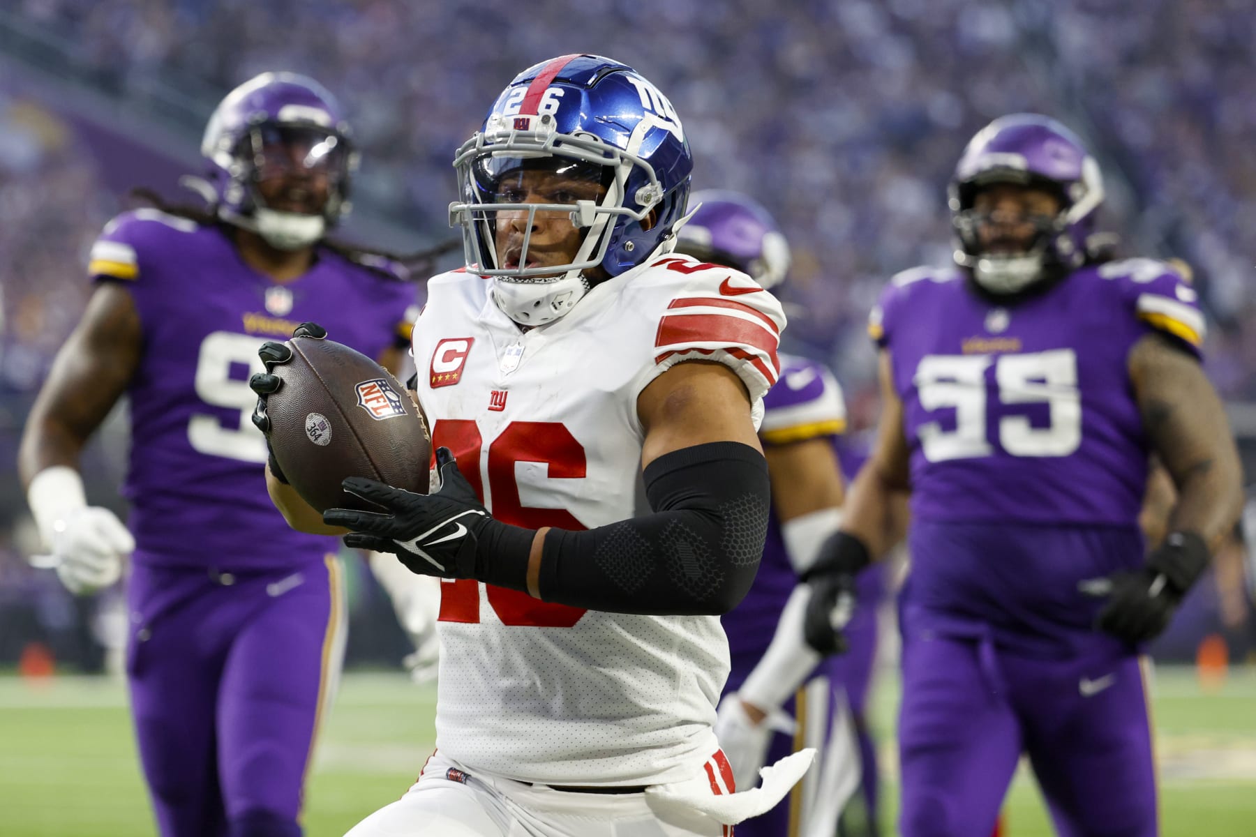 MINNEAPOLIS, MINNESOTA - JANUARY 15: Saquon Barkley #26 of the New York Giants rushes for a touchdown during the first quarter against the Minnesota Vikings in the NFC Wild Card playoff game at U.S. Bank Stadium on January 15, 2023 in Minneapolis, Minnesota. (Photo by David Berding/Getty Images)