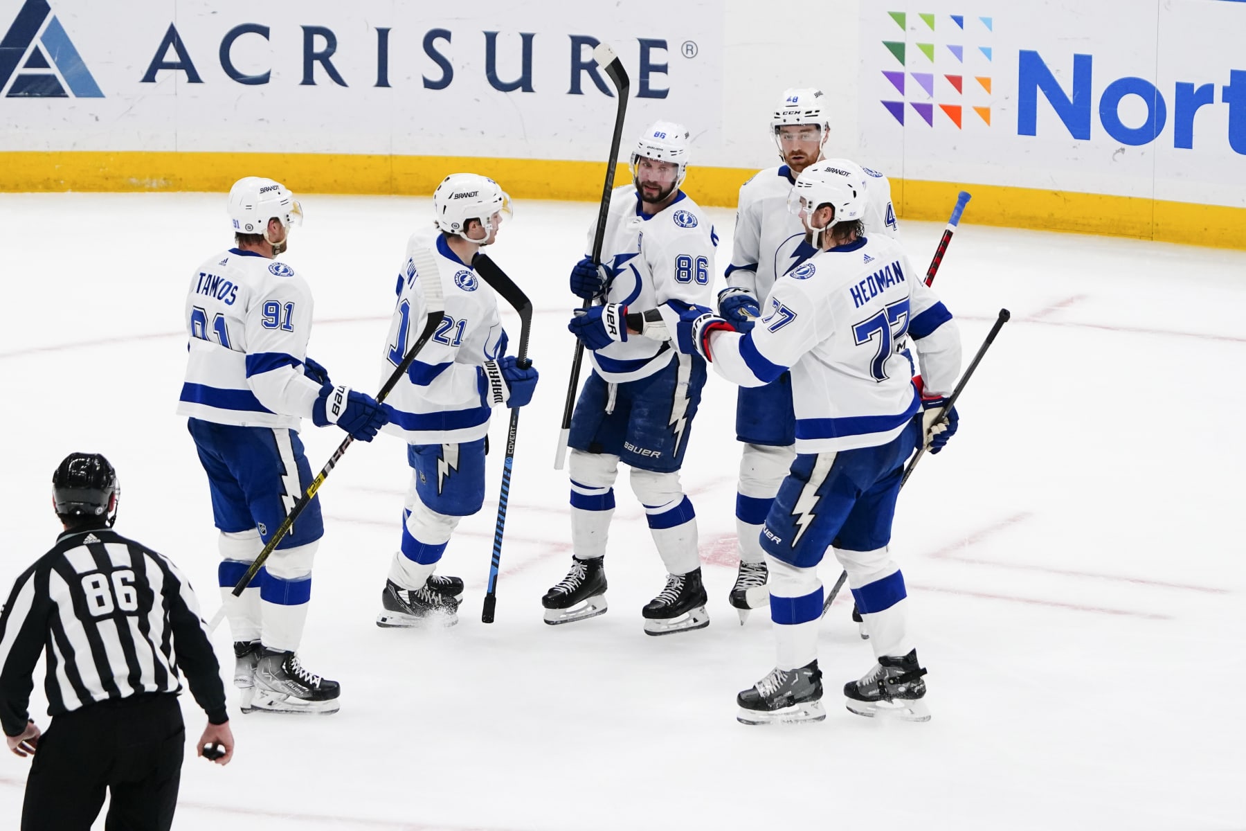 ELMONT, NY - APRIL 06: Tampa Bay Lightning Right Wing Nikita Kucherov (86) is congratulated by teammates for scoring a goal during the second period of the National Hockey League game between the Tampa Bay Lightning and the New York Islanders on April 6, 2023, at UBS Arena in Elmont, NY. (Photo by Gregory Fisher/Icon Sportswire via Getty Images)