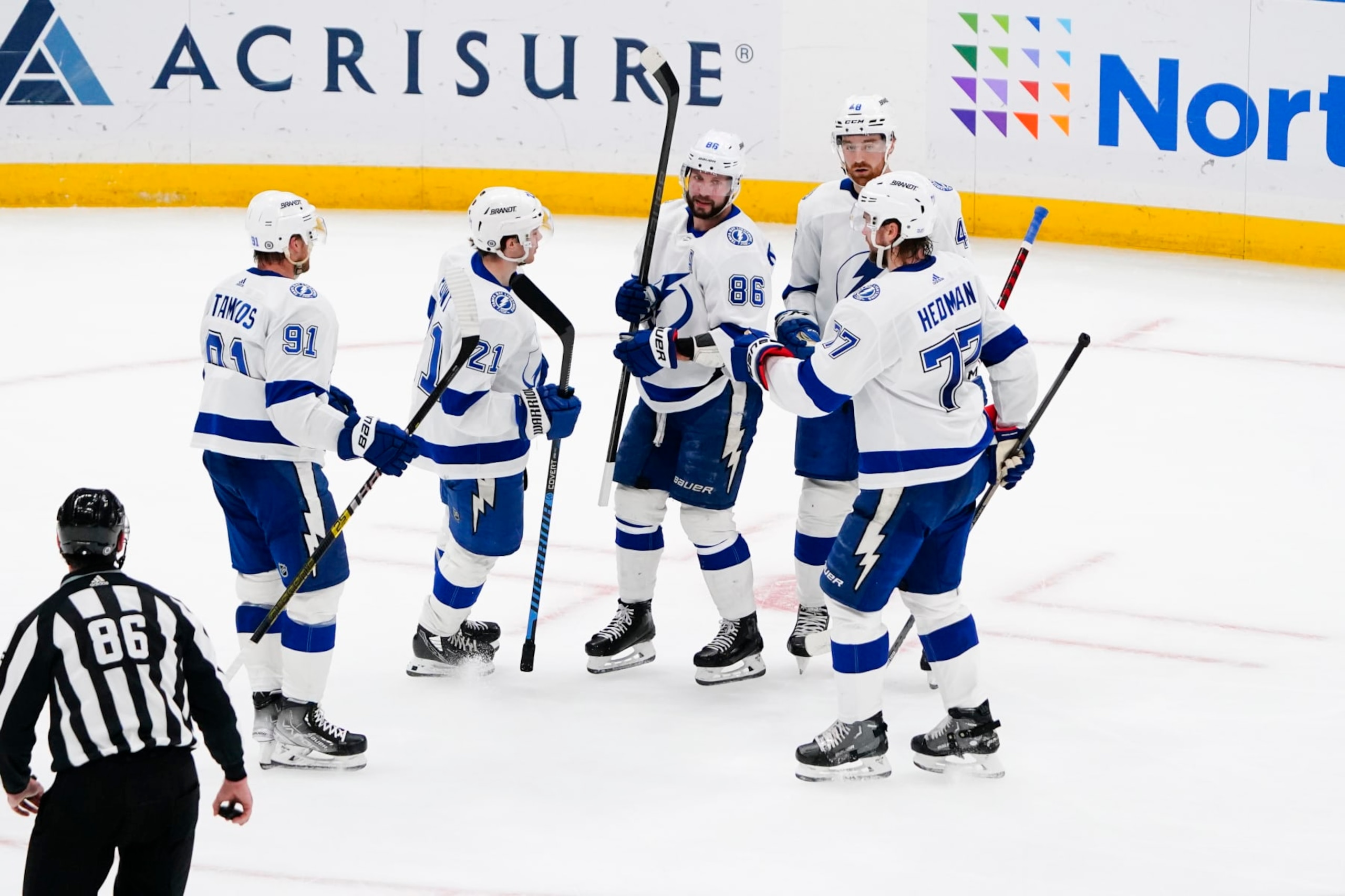 ELMONT, NY - APRIL 06: Tampa Bay Lightning Right Wing Nikita Kucherov (86) is congratulated by teammates for scoring a goal during the second period of the National Hockey League game between the Tampa Bay Lightning and the New York Islanders on April 6, 2023, at UBS Arena in Elmont, NY. (Photo by Gregory Fisher/Icon Sportswire via Getty Images)