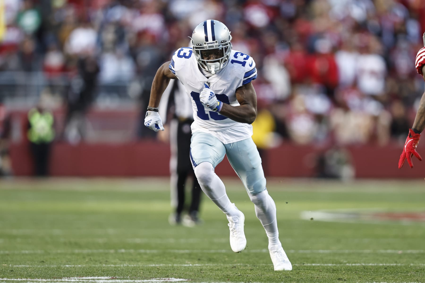 SANTA CLARA, CALIFORNIA - JANUARY 22: Michael Gallup #13 of the Dallas Cowboys runs during an NFL divisional round playoff football game between the San Francisco 49ers and the Dallas Cowboys at Levi's Stadium on January 22, 2023 in Santa Clara, California. (Photo by Michael Owens/Getty Images)