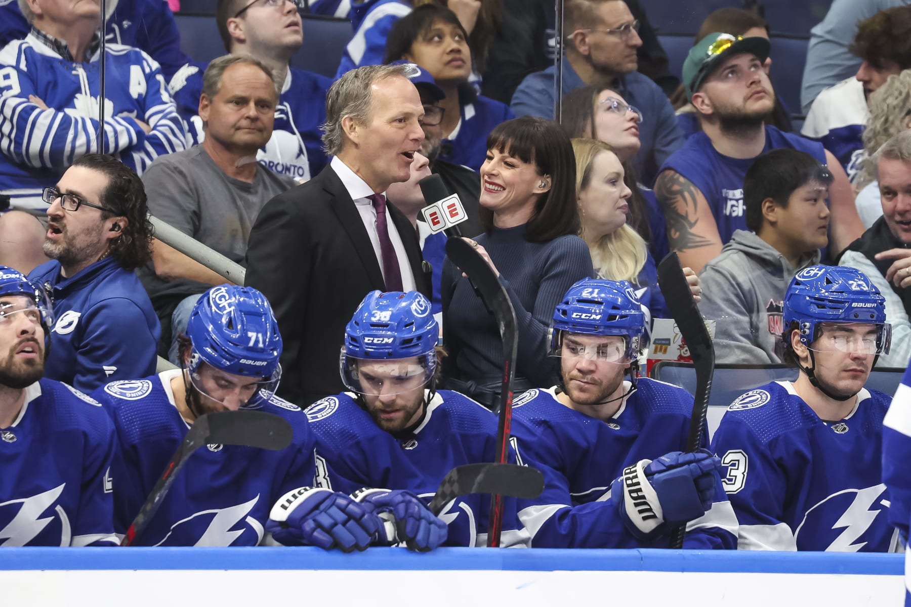 TAMPA, FL - APRIL 11: Head coach Jon Cooper of the Tampa Bay Lightning during an interview with Leah Hextall against the Toronto Maple Leafs during the second period at Amalie Arena on April 11, 2023 in Tampa, Florida. (Photo by Mark LoMoglio/NHLI via Getty Images)
