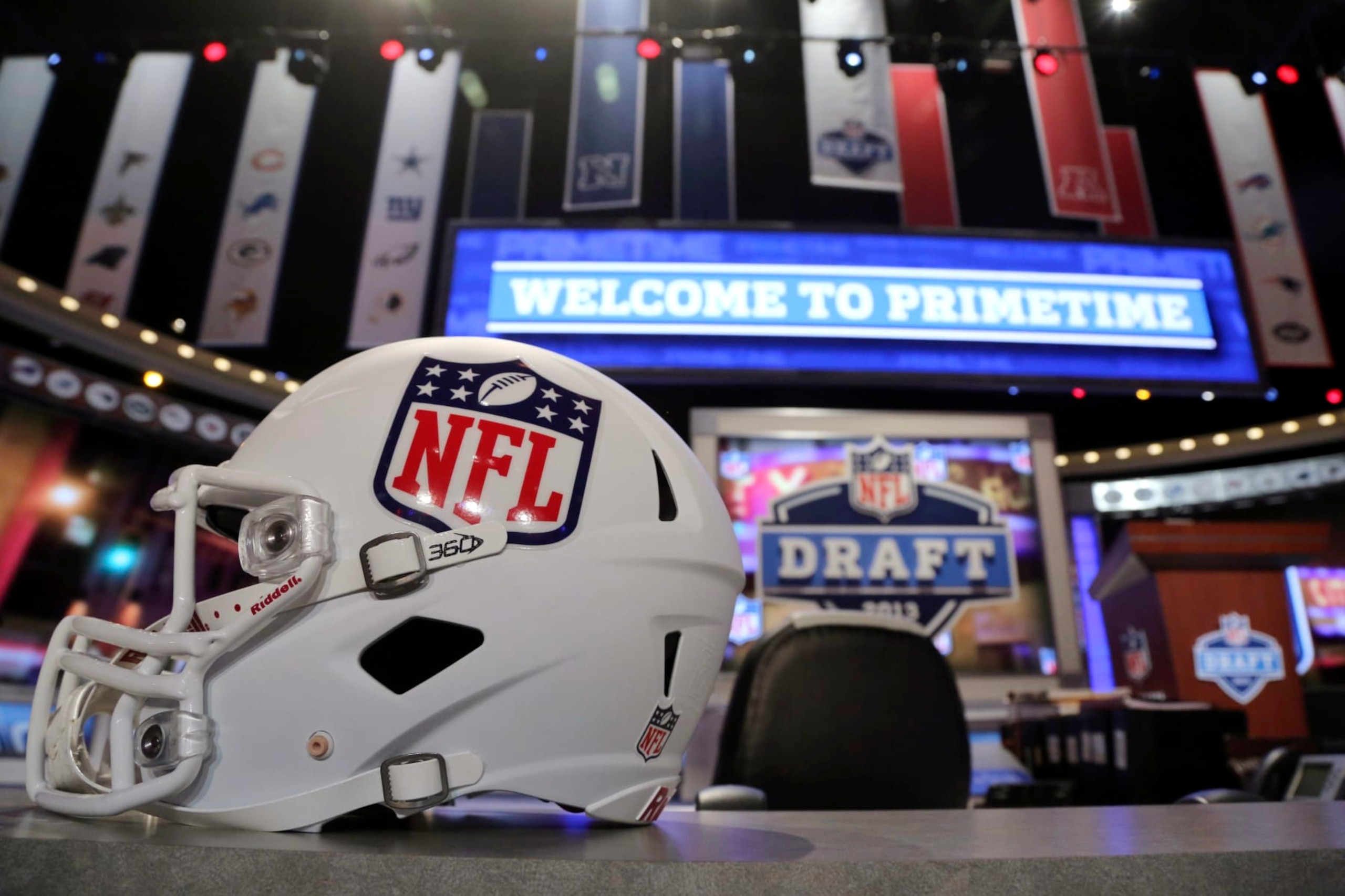 A helmet with the NFL logo is placed on a table before the NFL football draft, Thursday, April 25, 2013, at Radio City Music Hall in New York. (AP Photo/Mary Altaffer)