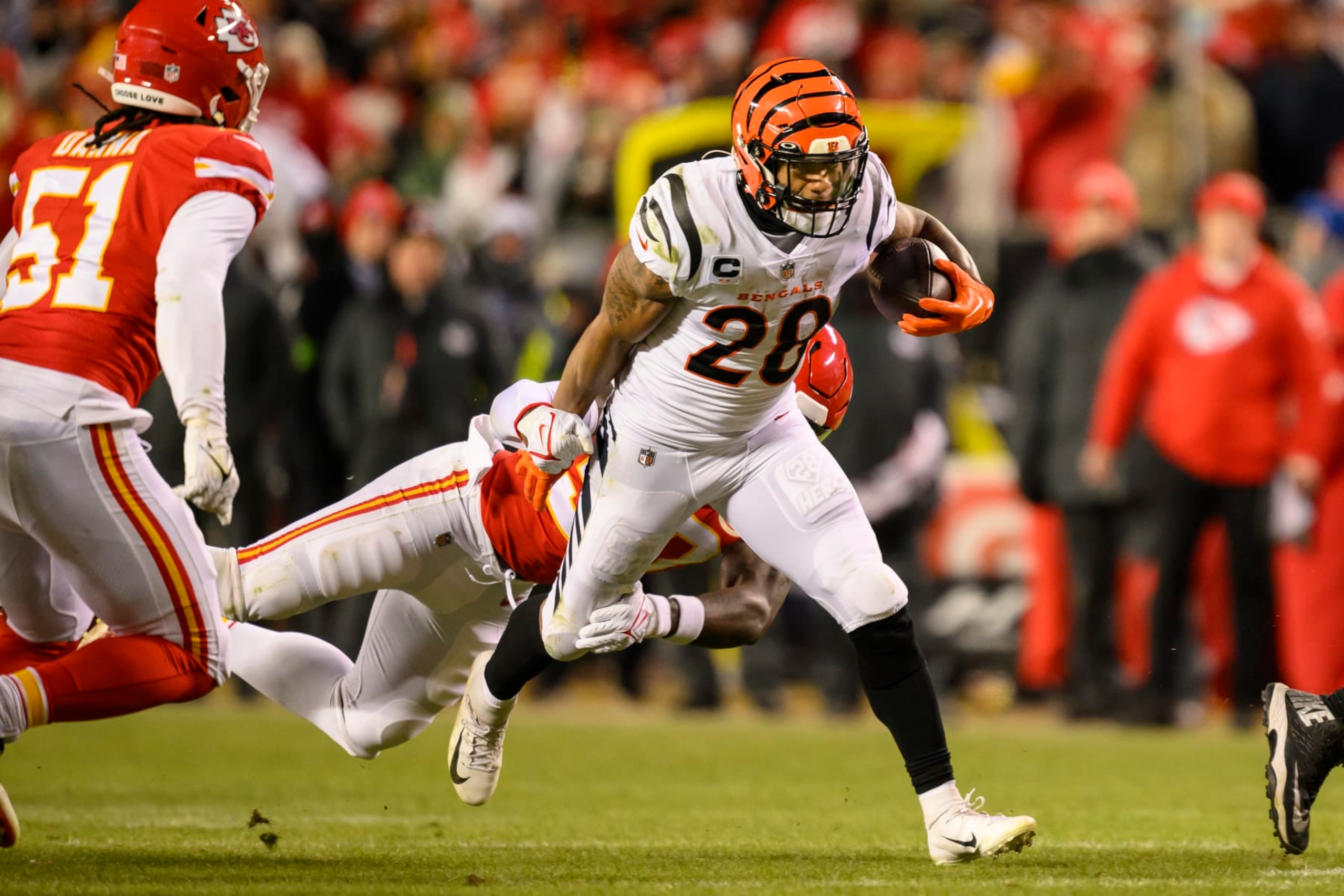 Cincinnati Bengals running back Joe Mixon (28) sheds an attempted tackle by Kansas City Chiefs linebacker Willie Gay (50) during the second half of the NFL AFC Championship playoff football game, Sunday, Jan. 29, 2023 in Kansas City, Mo. (AP Photo/Reed Hoffmann) Cincinnati Bengals running back Joe Mixon (28) sheds an attempted tackle by Kansas City Chiefs linebacker Willie Gay (50) during the second half of the NFL AFC Championship playoff football game, Sunday, Jan. 29, 2023 in Kansas City, Mo. (AP Photo/Reed Hoffmann)
