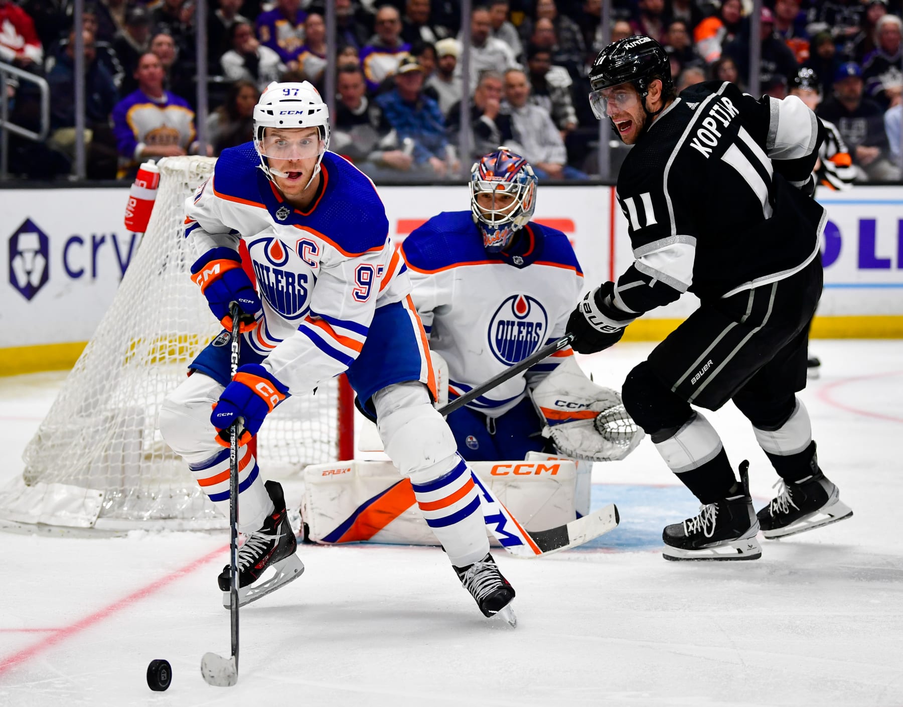 Edmonton Oilers captain Connor McDavid (left) and Los Angeles Kings captain Anze Kopitar.