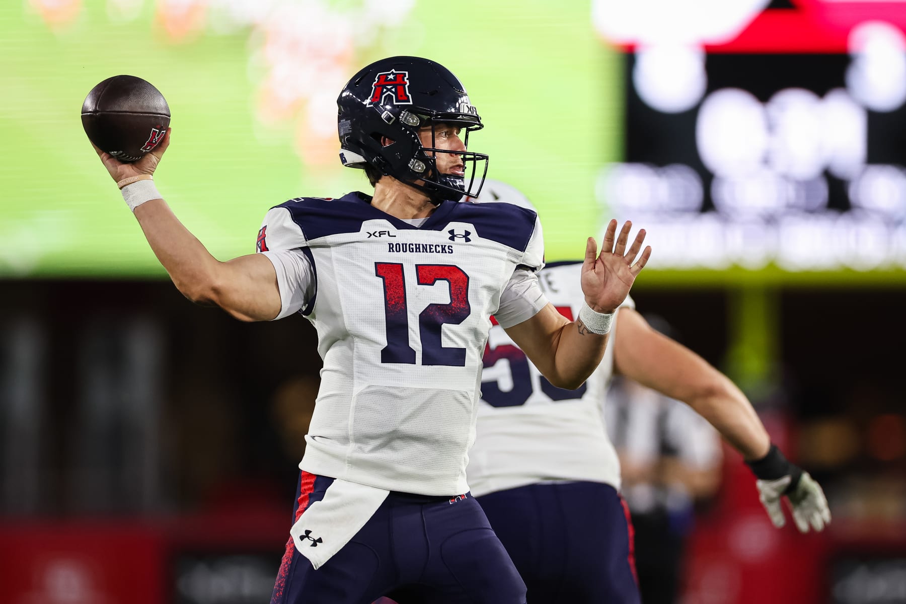 WASHINGTON, DC - MARCH 27: Brandon Silvers #12 of the Houston Roughnecks attempts a pass against the DC Defenders during the first half of the XFL game at Audi Field on March 27, 2023 in Washington, DC. (Photo by Scott Taetsch/Getty Images)