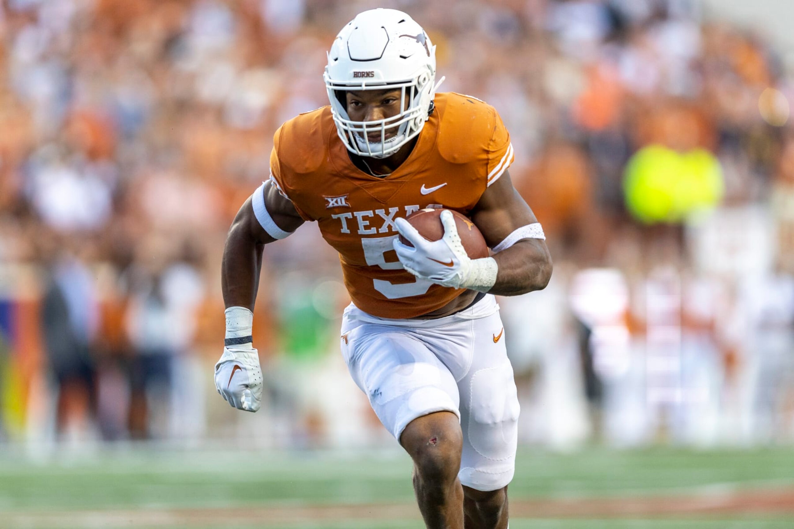 Texas running back Bijan Robinson carries against West Virginia during the first half of an NCAA college football game Saturday, Oct. 1, 2022, in Austin, Texas. (AP Photo/Stephen Spillman)
