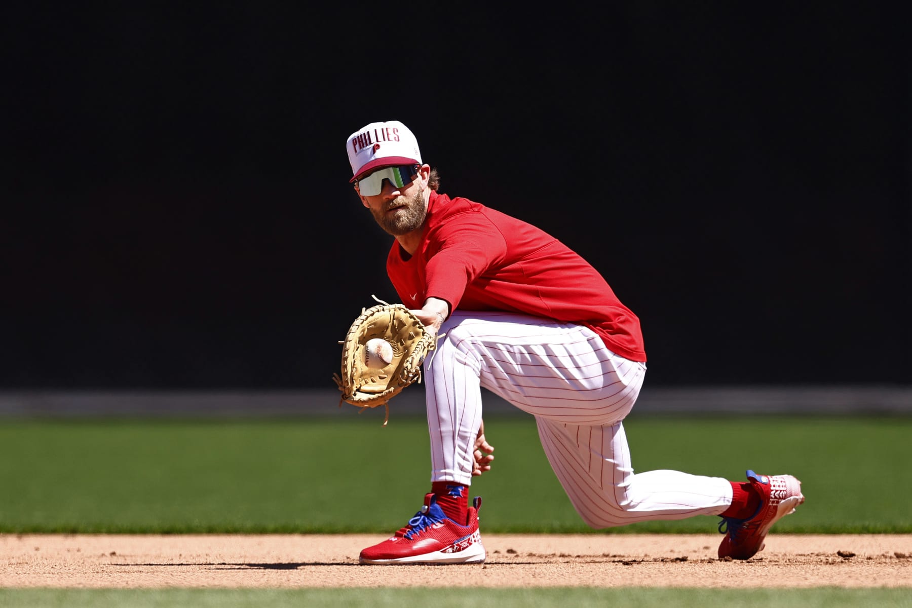 PHILADELPHIA, PA - APRIL 12: Bryce Harper #3 of the Philadelphia Phillies takes ground balls at first base before a game against the Miami Marlins at Citizens Bank Park on April 12, 2023 in Philadelphia, Pennsylvania. (Photo by Rich Schultz/Getty Images)