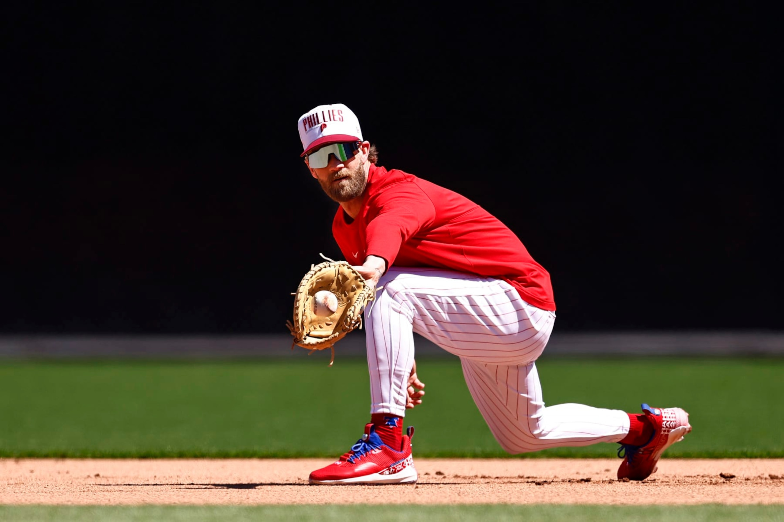 PHILADELPHIA, PA - APRIL 12: Bryce Harper #3 of the Philadelphia Phillies takes ground balls at first base before a game against the Miami Marlins at Citizens Bank Park on April 12, 2023 in Philadelphia, Pennsylvania. (Photo by Rich Schultz/Getty Images) PHILADELPHIA, PA - APRIL 12: Bryce Harper #3 of the Philadelphia Phillies takes ground balls at first base before a game against the Miami Marlins at Citizens Bank Park on April 12, 2023 in Philadelphia, Pennsylvania. (Photo by Rich Schultz/Getty Images)