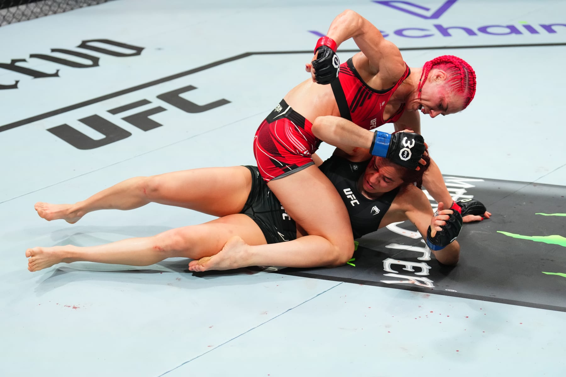 KANSAS CITY, MISSOURI - APRIL 15: (L-R) Gillian Robertson of Canada punches Piera Rodriguez of Venezuela in a strawweight fight during the UFC Fight Night event at T-Mobile Center on April 15, 2023 in Kansas City, Missouri. (Photo by Josh Hedges/Zuffa LLC via Getty Images)