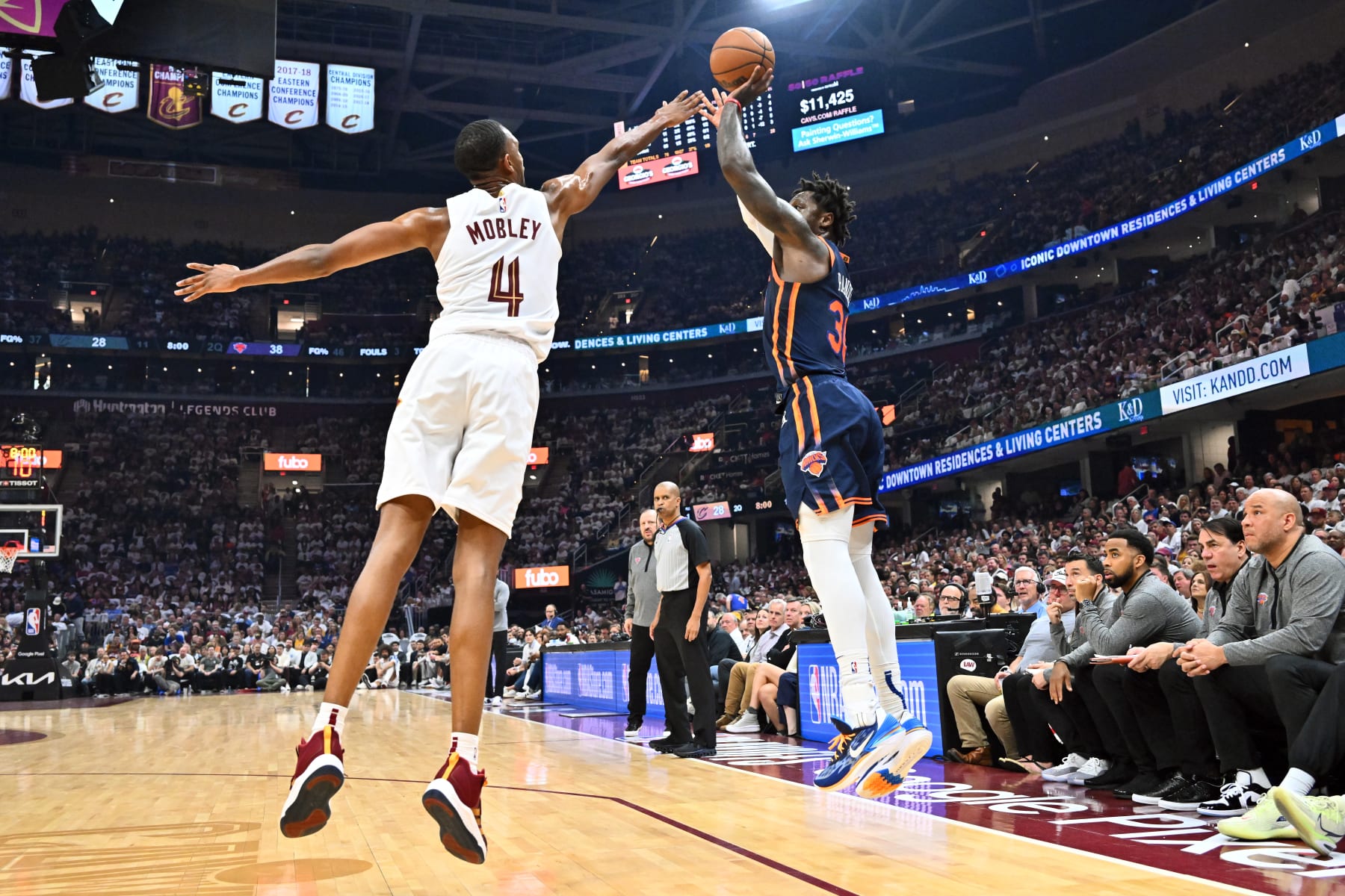 CLEVELAND, OHIO - APRIL 15: Julius Randle #30 of the New York Knicks shoots over Evan Mobley #4 of the Cleveland Cavaliers during the first half of Game One of the Eastern Conference First Round Playoffs at Rocket Mortgage Fieldhouse on April 15, 2023 in Cleveland, Ohio. NOTE TO USER: User expressly acknowledges and agrees that, by downloading and or using this photograph, User is consenting to the terms and conditions of the Getty Images License Agreement. (Photo by Jason Miller/Getty Images)