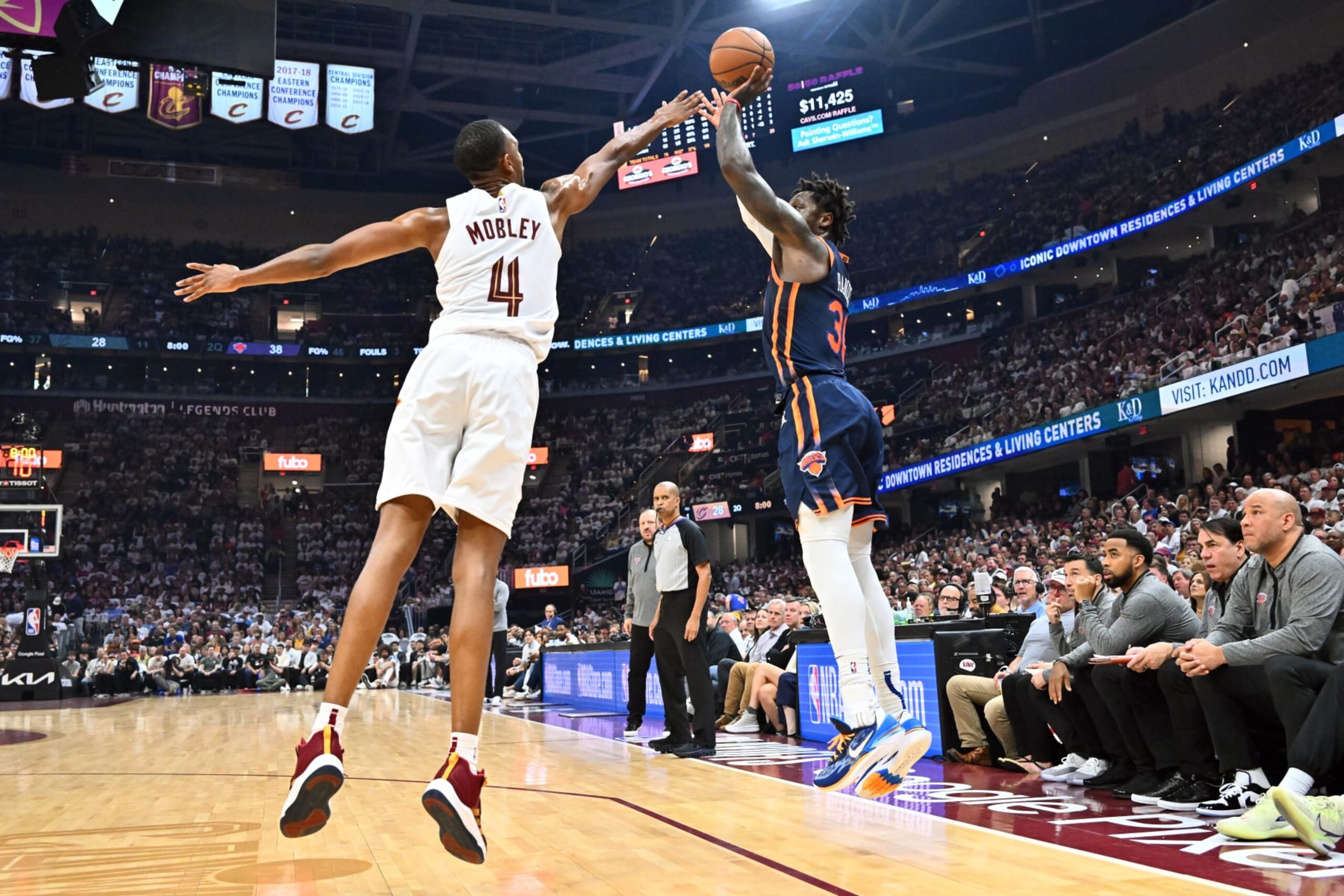 CLEVELAND, OHIO - APRIL 15: Julius Randle #30 of the New York Knicks shoots over Evan Mobley #4 of the Cleveland Cavaliers during the first half of Game One of the Eastern Conference First Round Playoffs at Rocket Mortgage Fieldhouse on April 15, 2023 in Cleveland, Ohio. NOTE TO USER: User expressly acknowledges and agrees that, by downloading and or using this photograph, User is consenting to the terms and conditions of the Getty Images License Agreement. (Photo by Jason Miller/Getty Images)